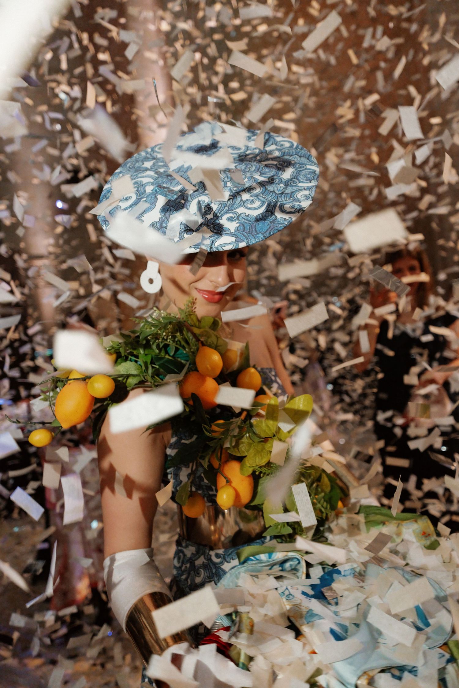 The image shows a fantastical, whimsical sculpture made of various materials and objects, with a surreal, dreamlike quality.