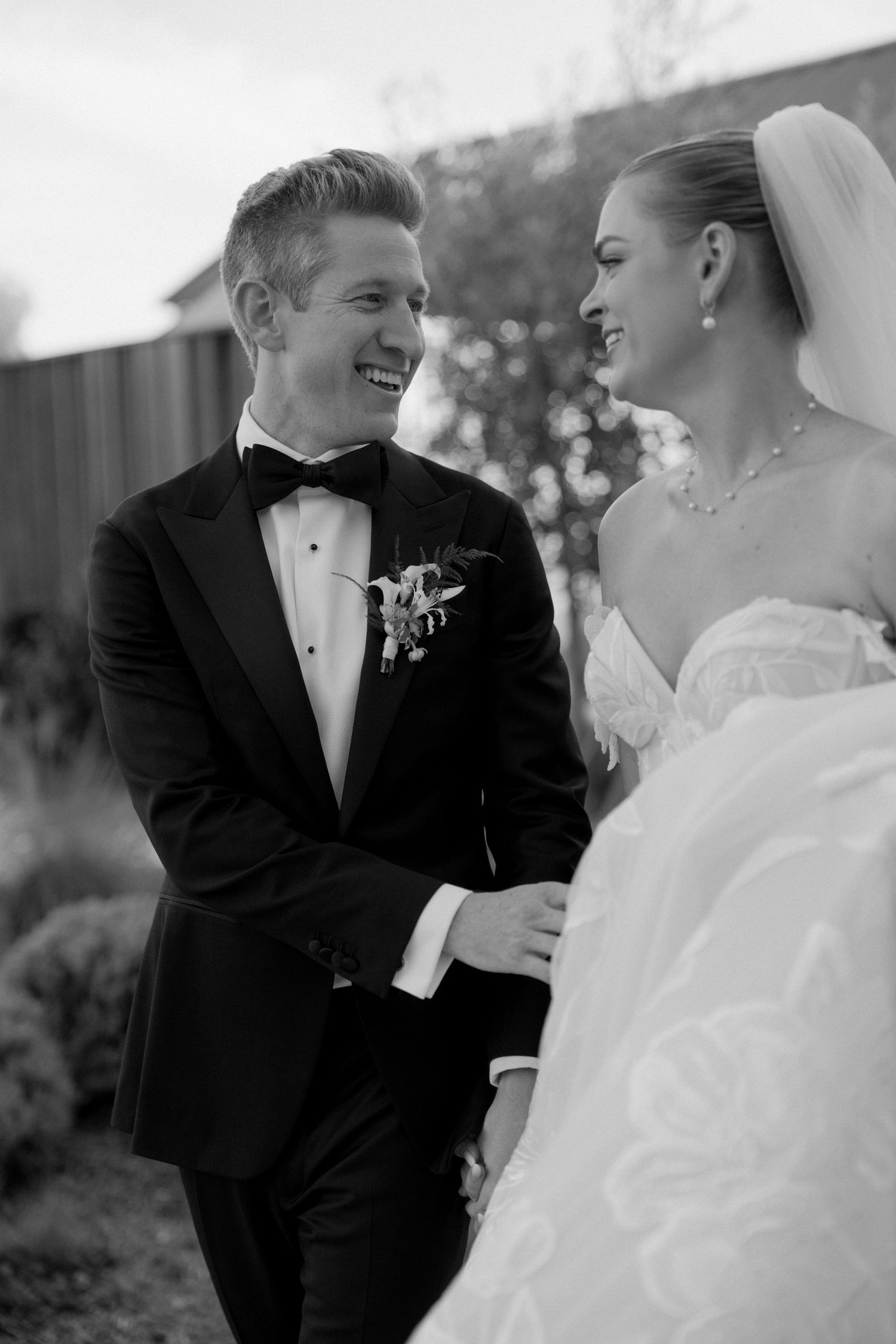 Black and white romantic wedding portraits showing tender moments between newlyweds.