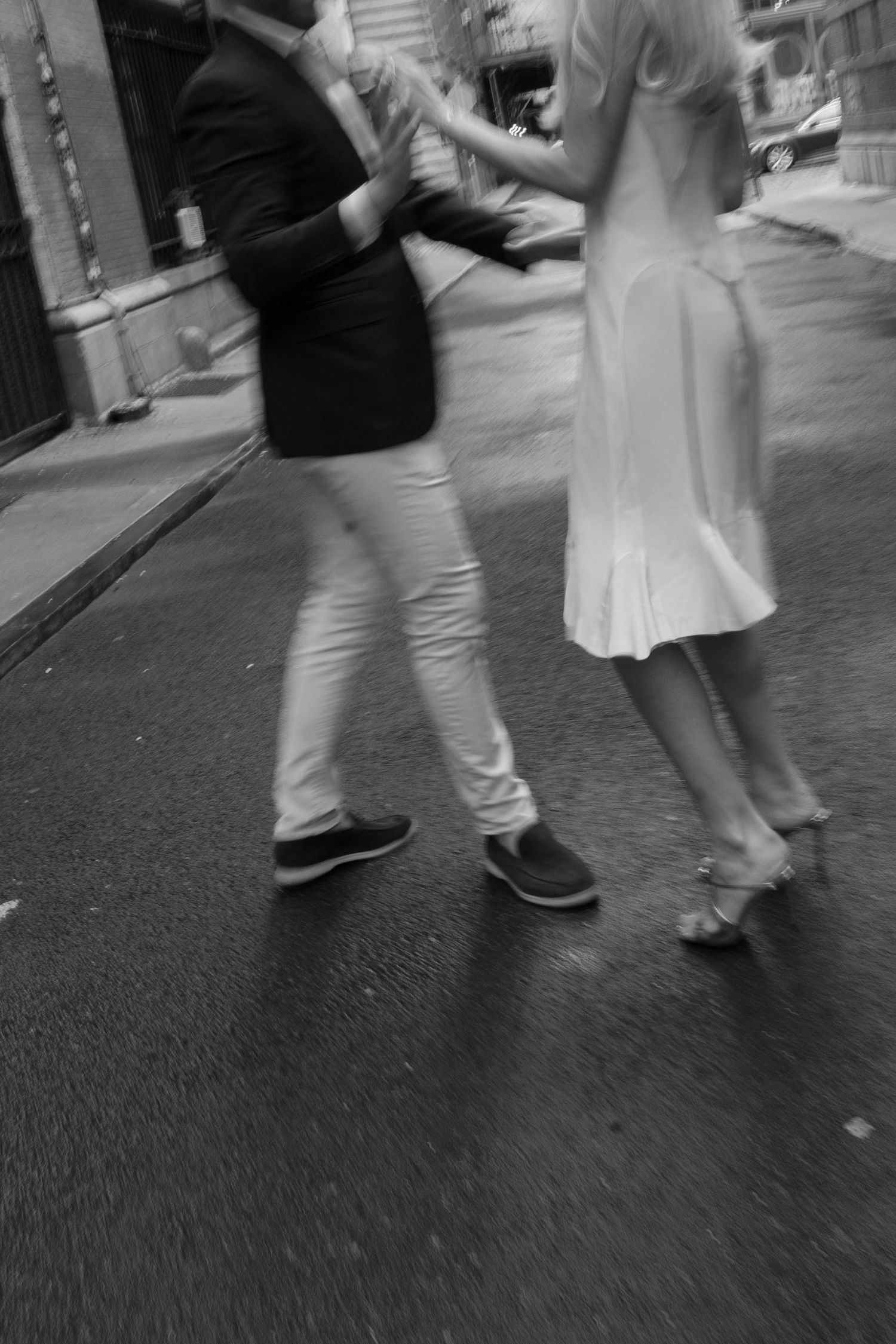 Low angle view of feet dancing on an urban street.