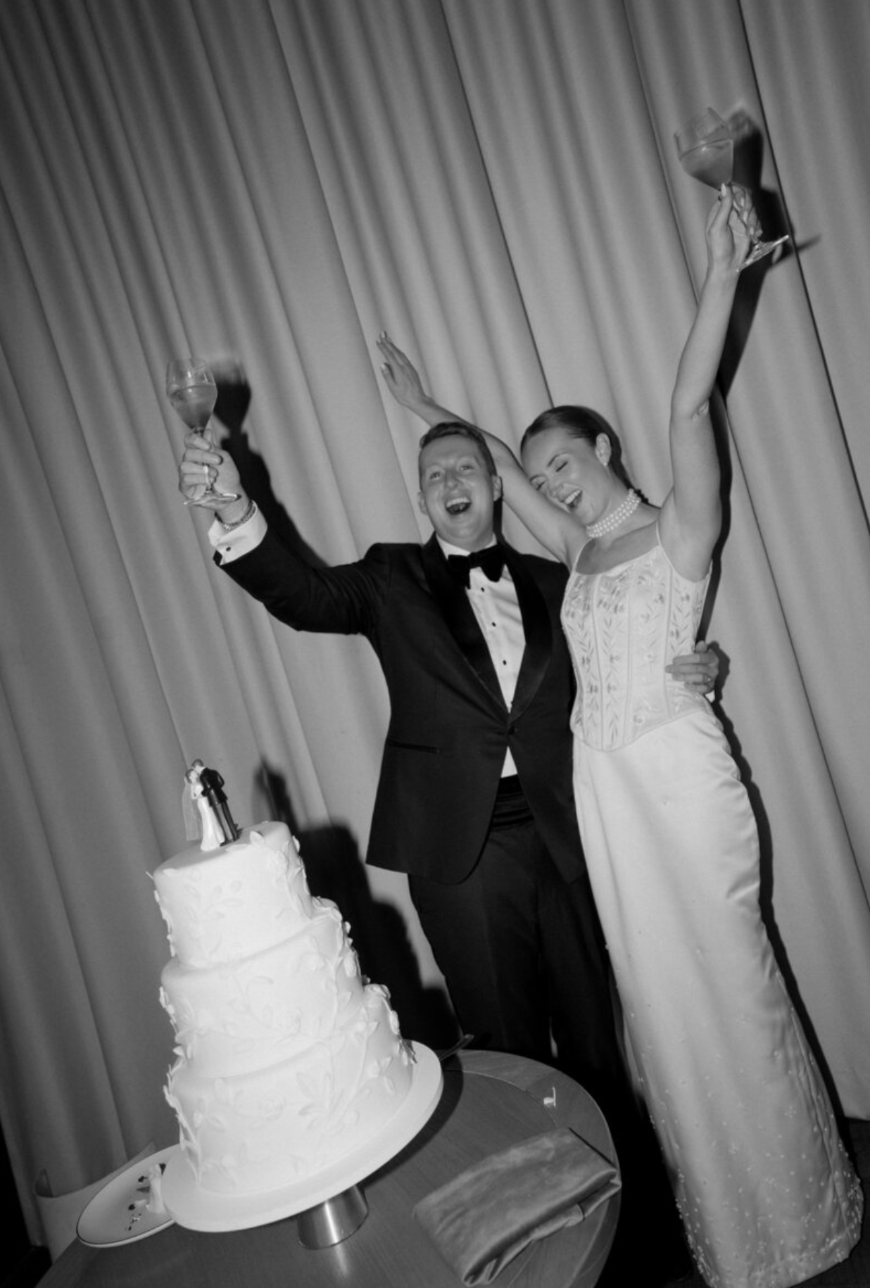 A series of black and white photo booth style wedding photos showing a couple celebrating and posing playfully together.