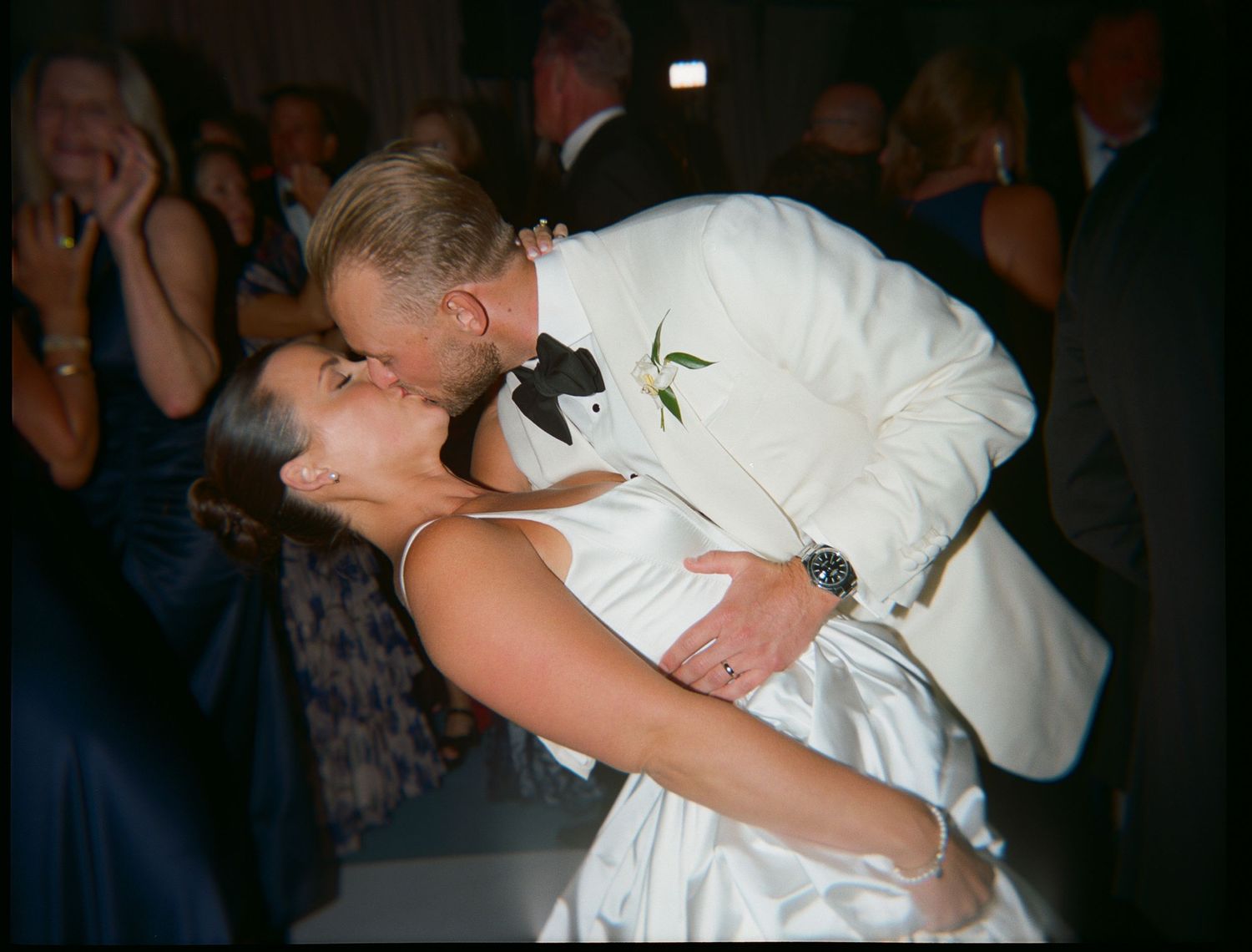 A couple shares a romantic dance moment at their wedding reception.