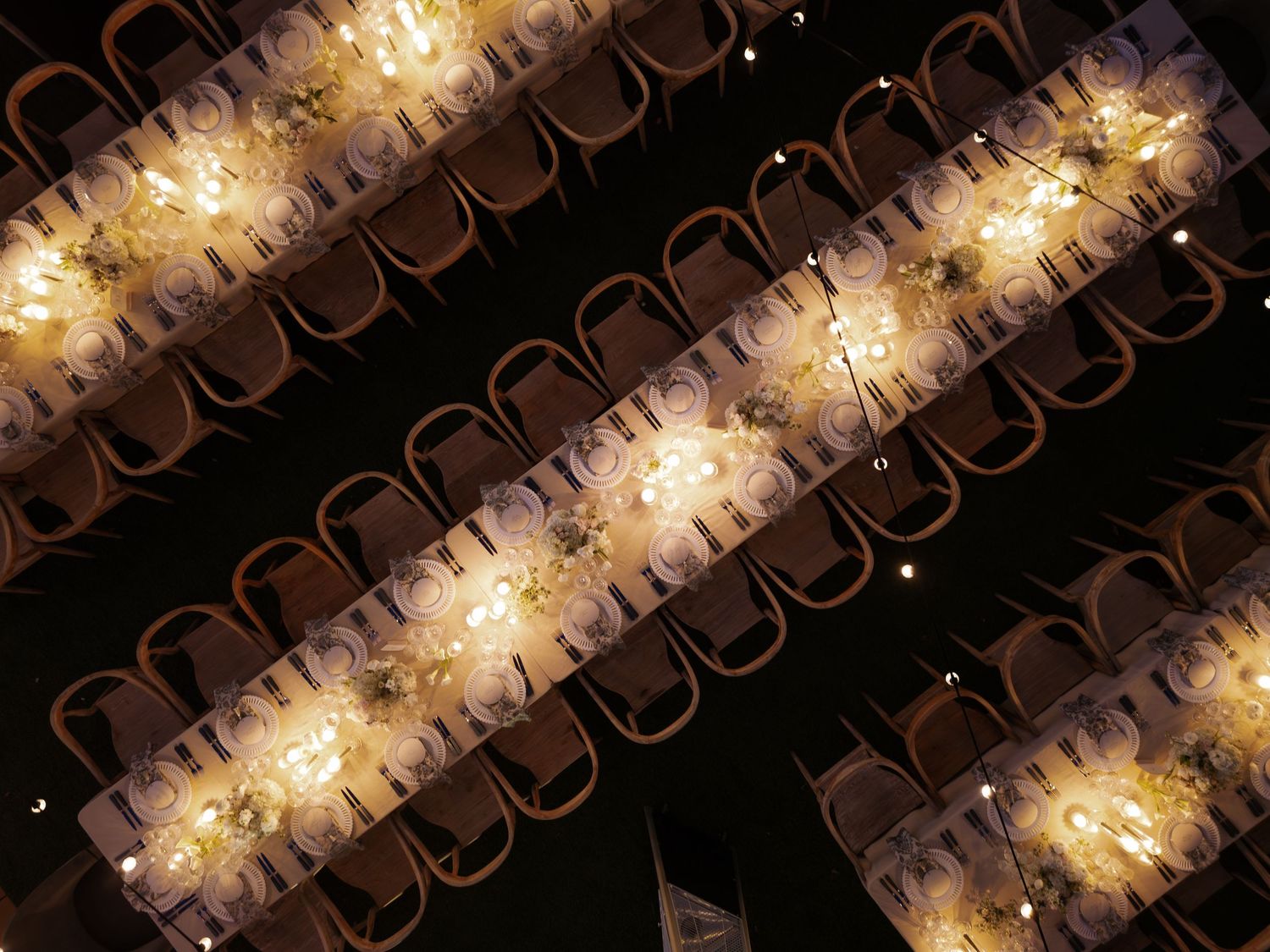 Abstract pattern of glowing lights creating a decorative spiral effect against a dark background.