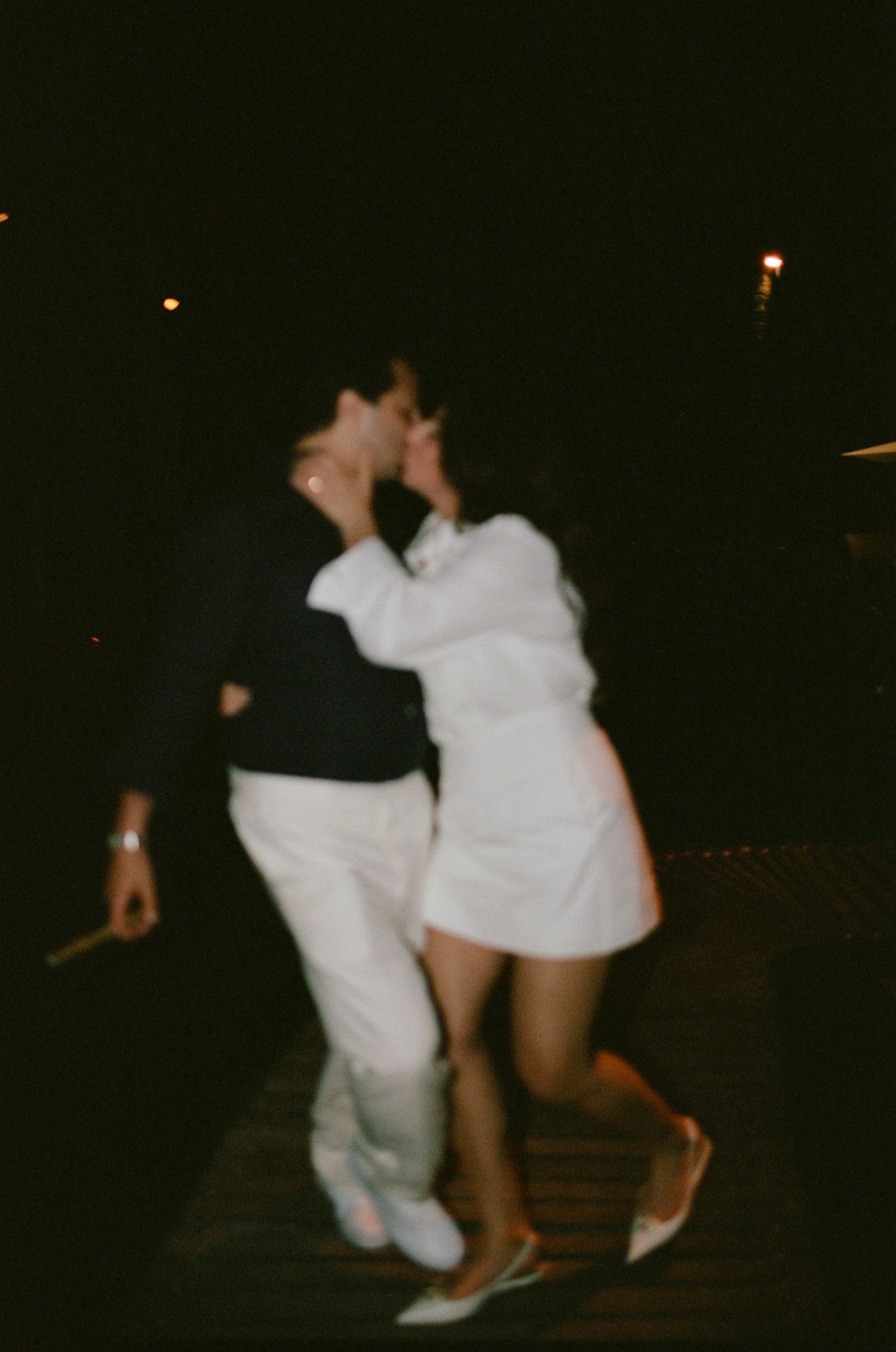 Blurry nighttime dance photos showing movement and celebration.