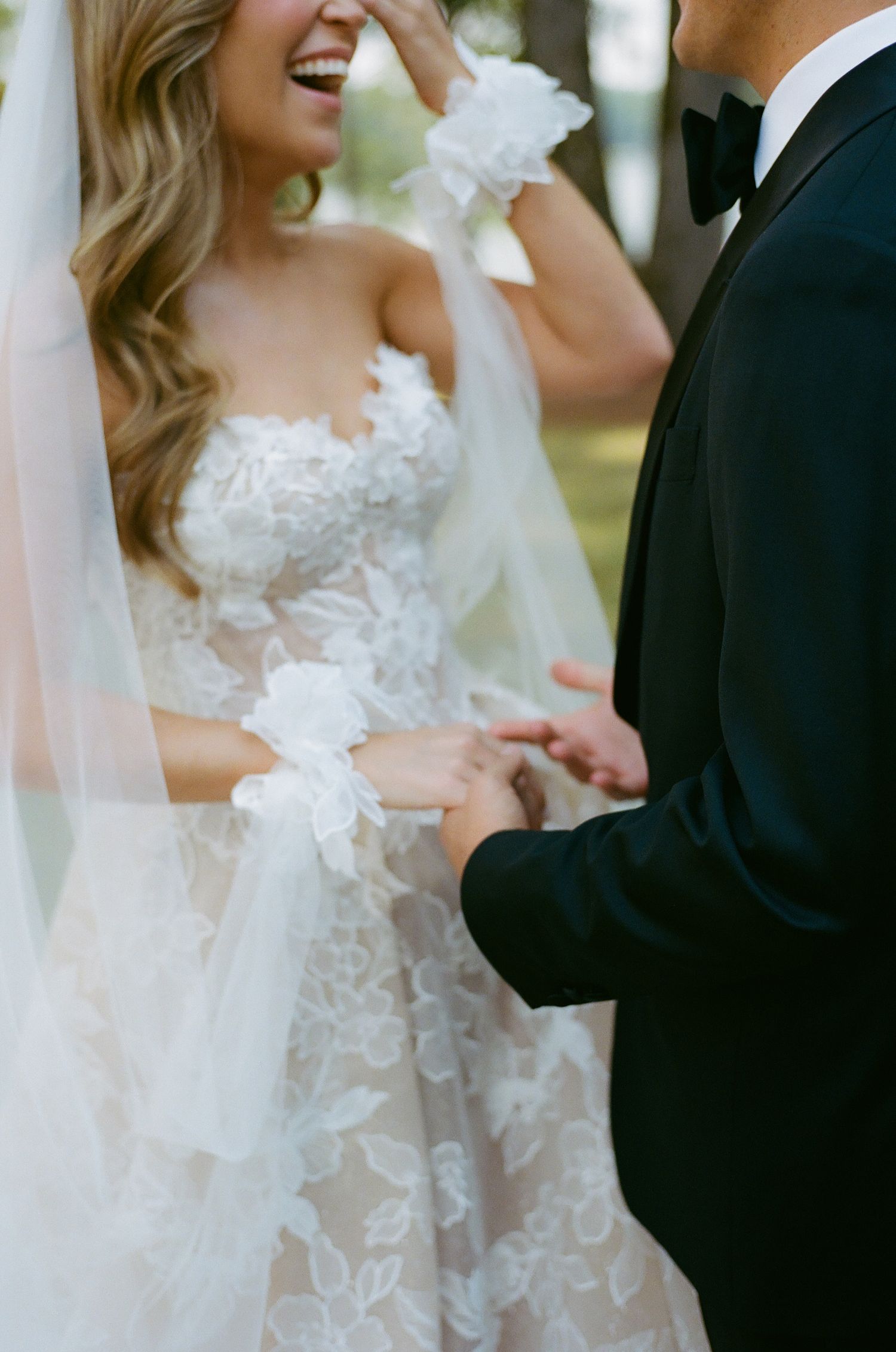 Candid wedding portraits showing joyful laughter between the couple.