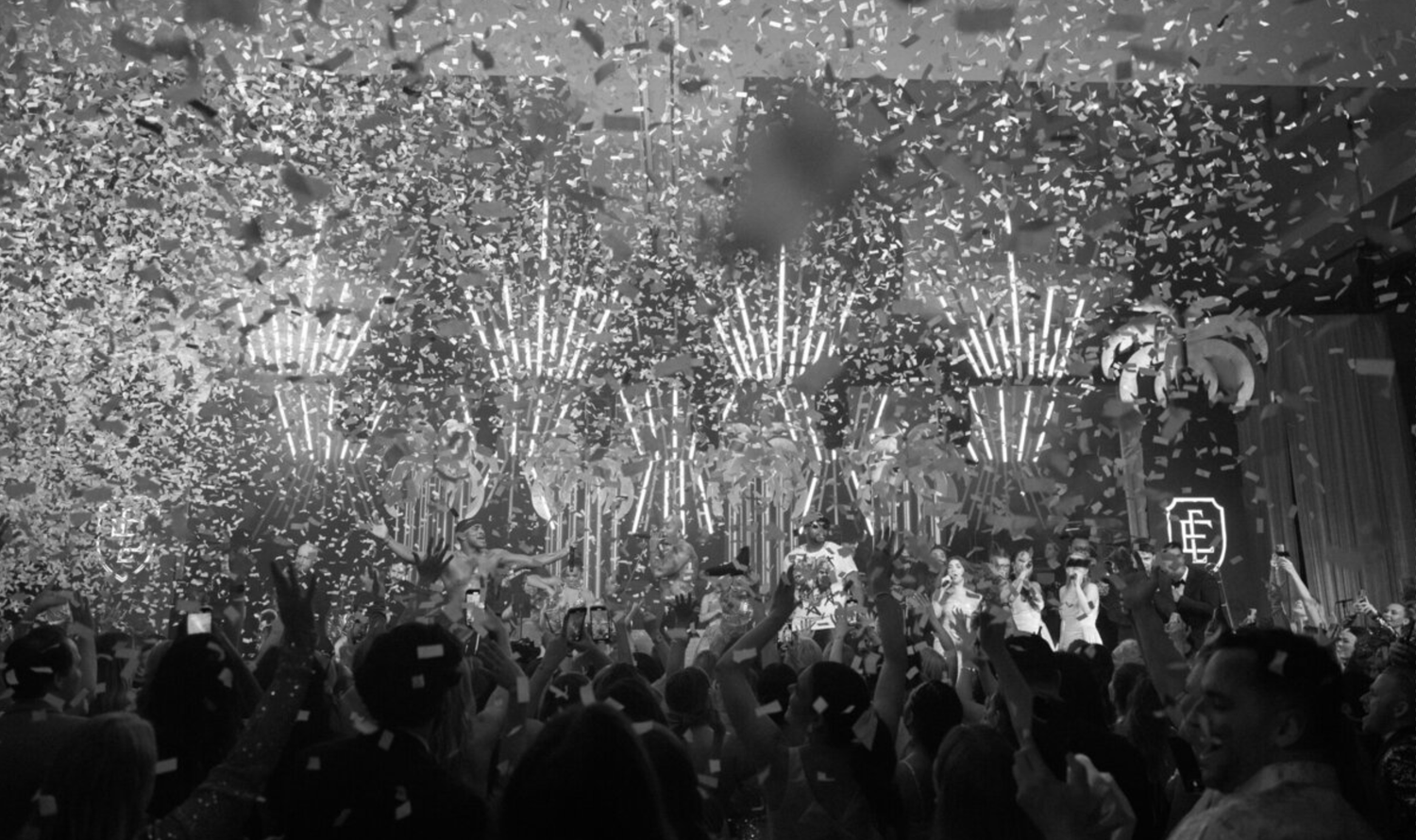 Spectacular fireworks and pyrotechnics display illuminating a crowded concert venue.