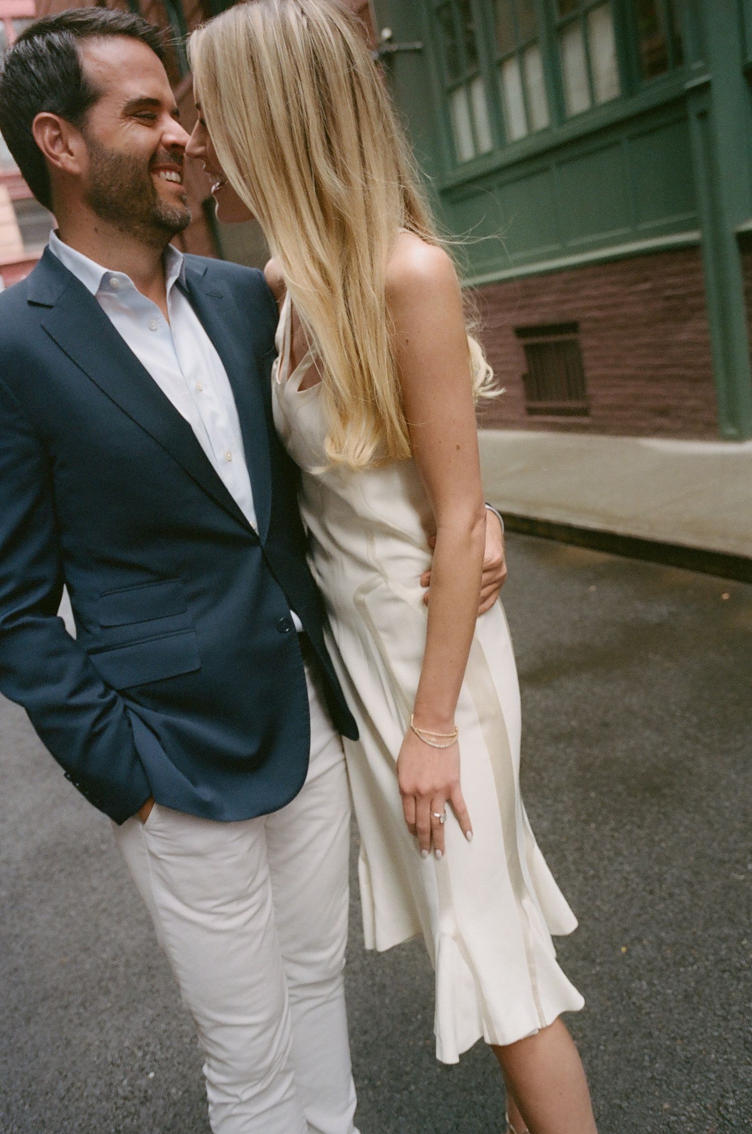 A playful dance sequence captured on a vintage-looking urban street.