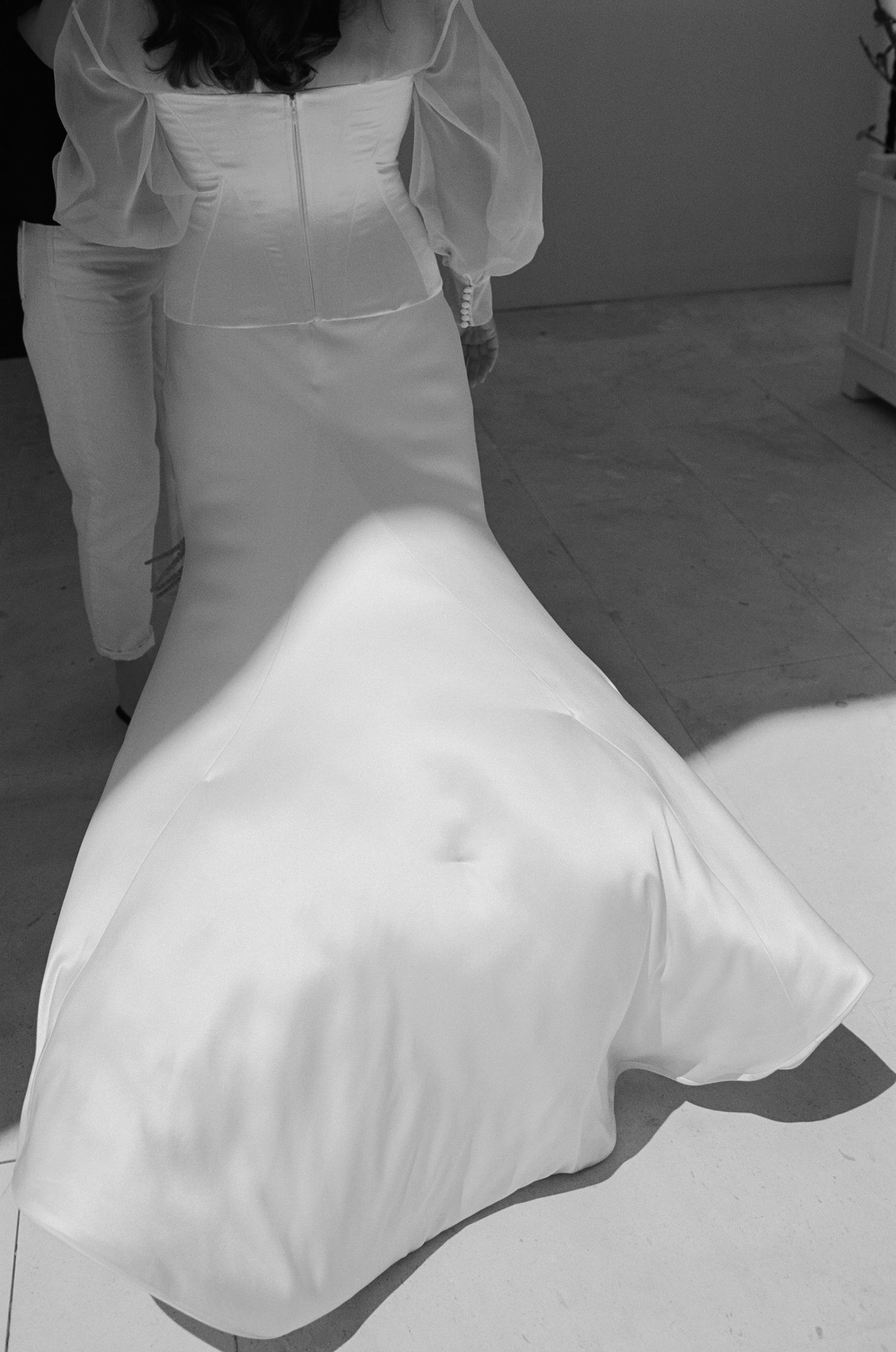 Flowing white wedding dress twirling in a series of motion shots.