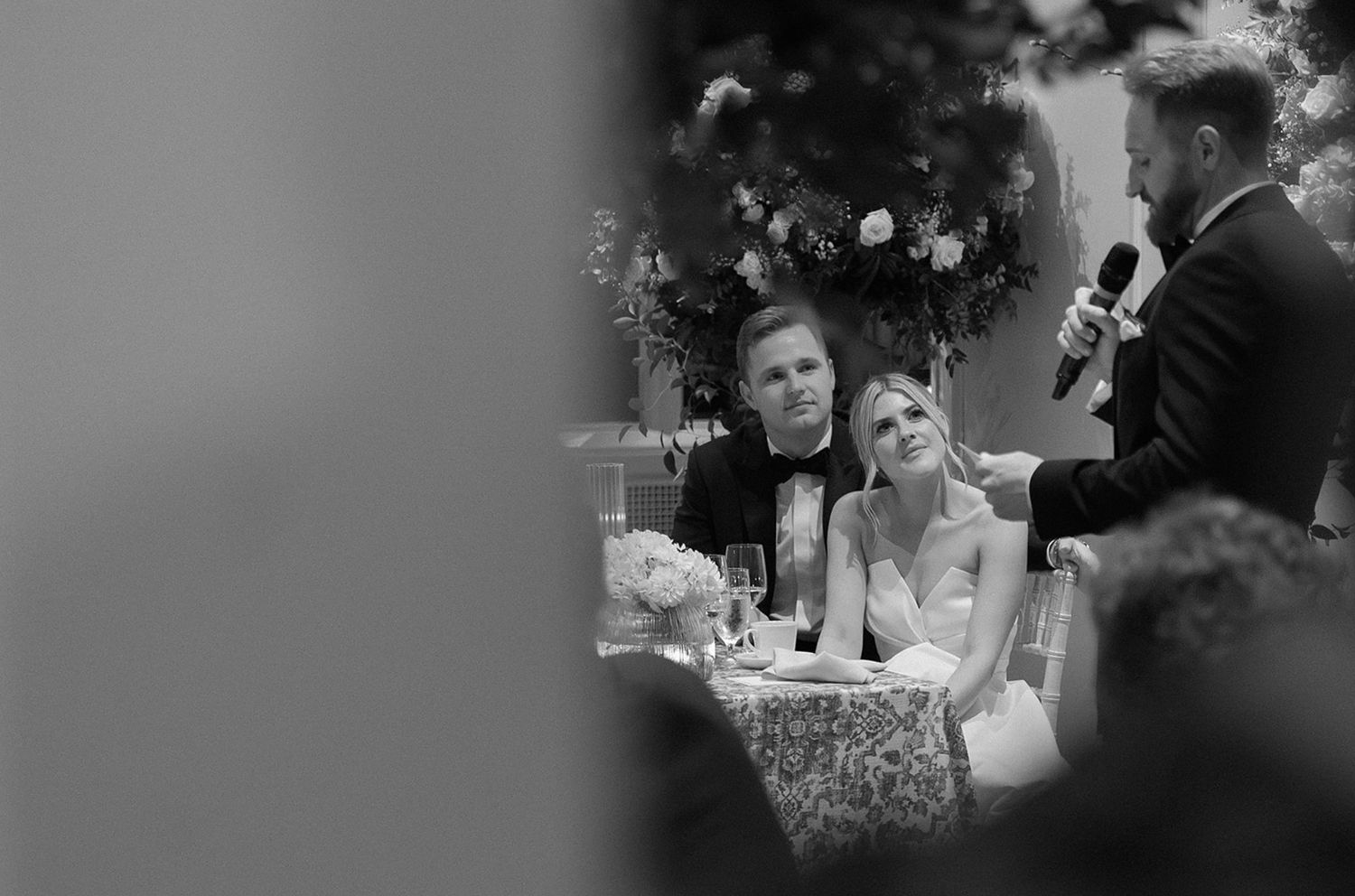 Black and white candid shots of wedding reception celebrations.