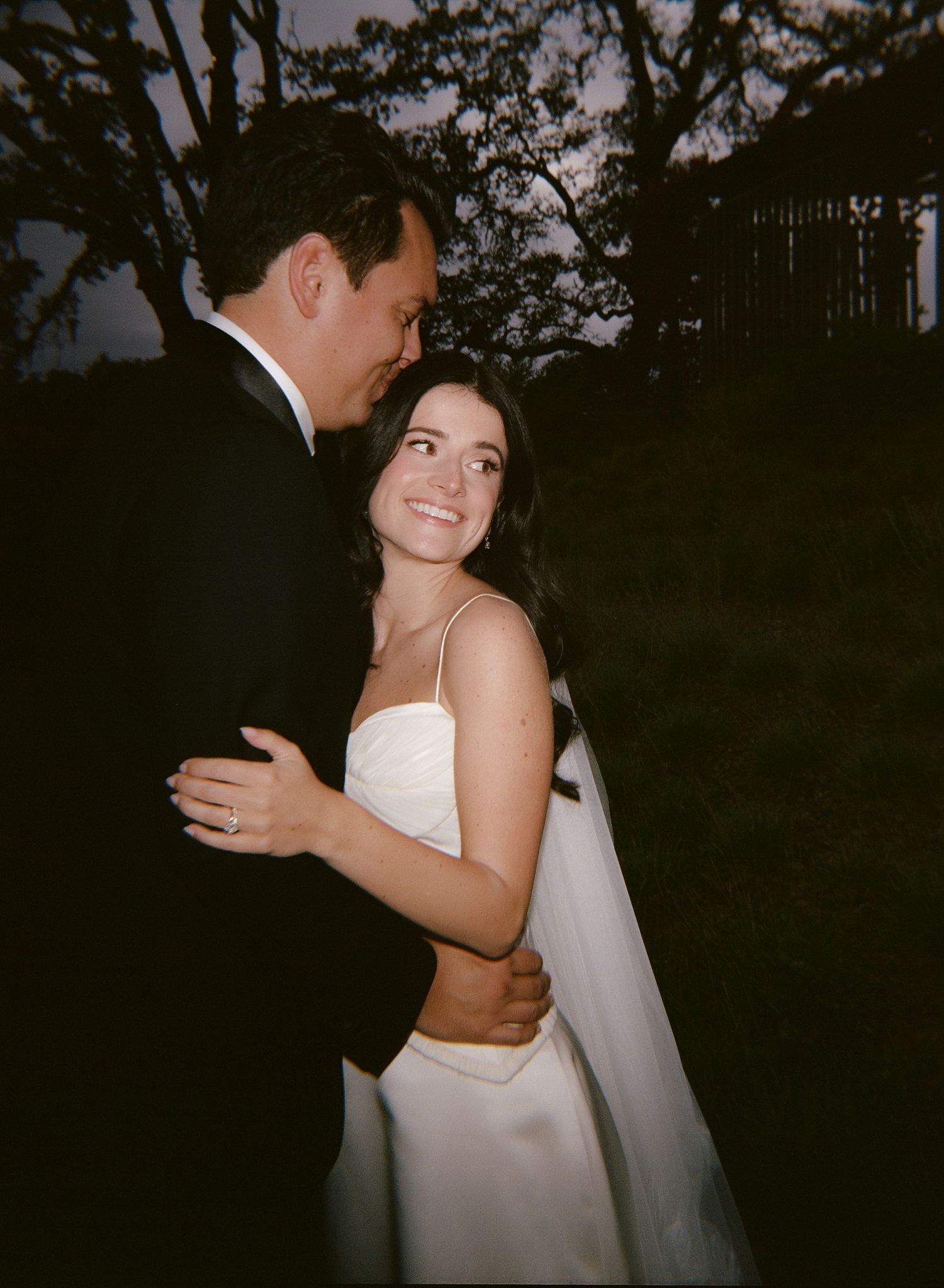 Intimate black and white dance photos capture tender moments at an elegant wedding reception.