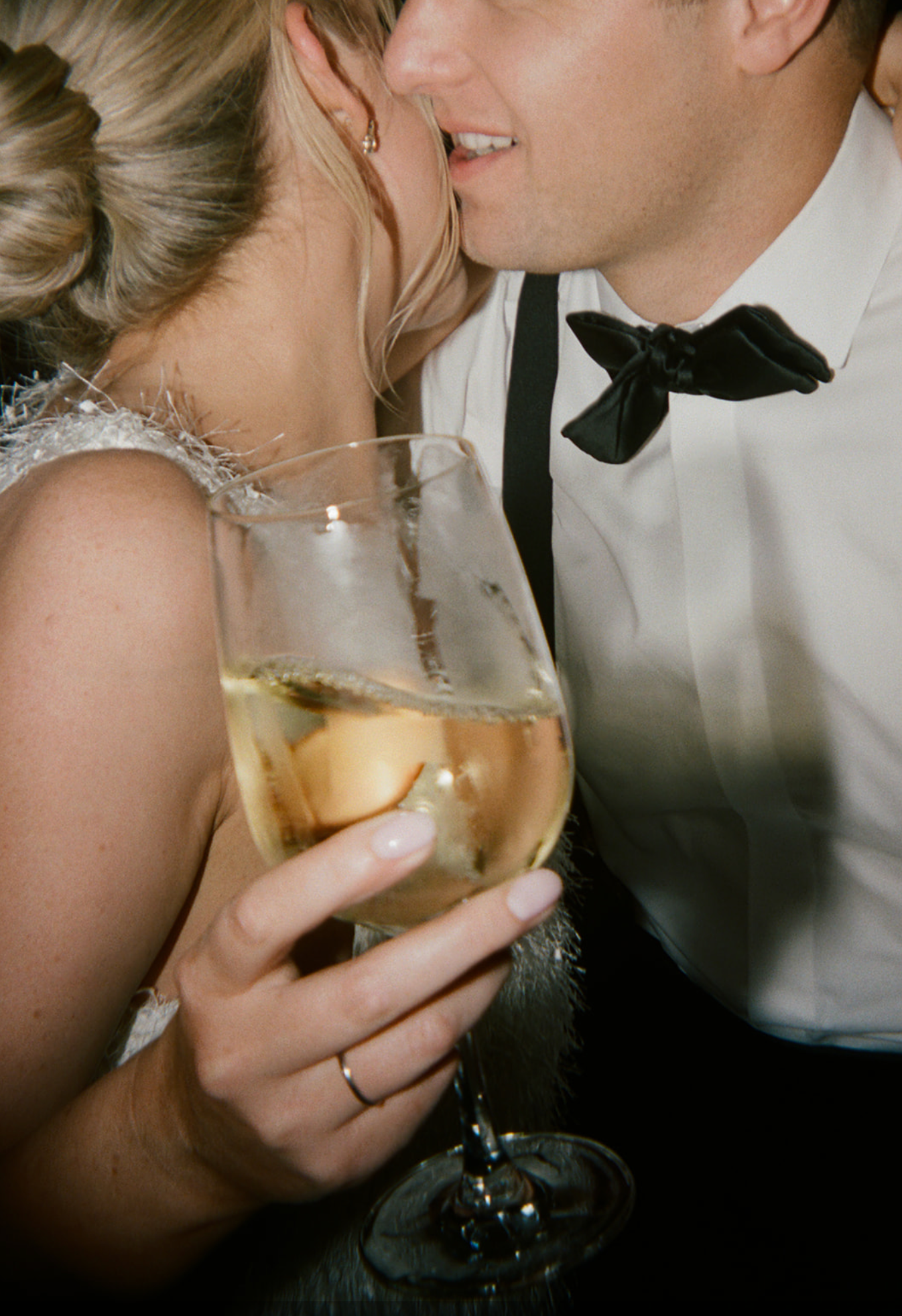 Close-up shots of couple sharing champagne during wedding celebration.