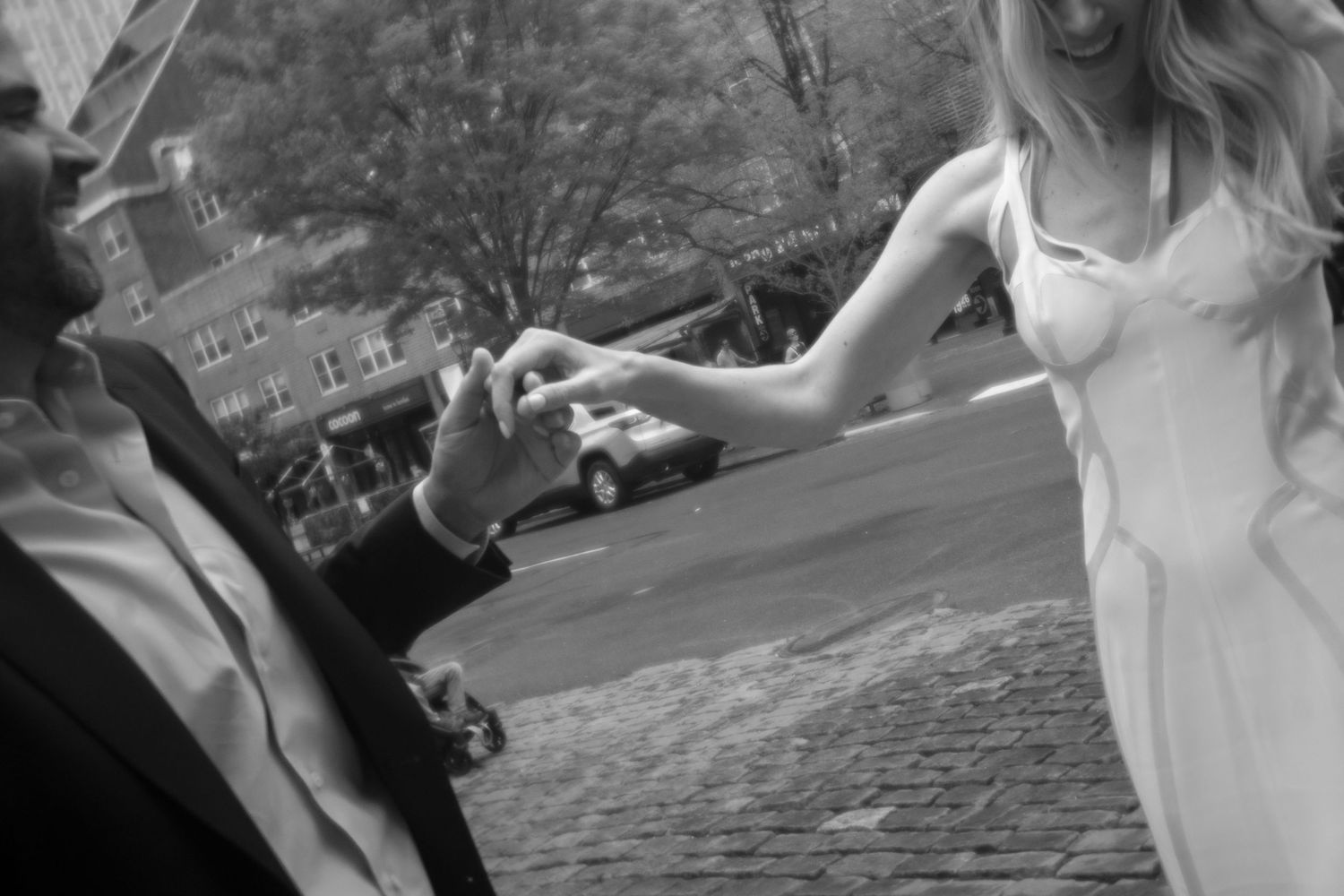 A couple shares an intimate moment while dancing outdoors.