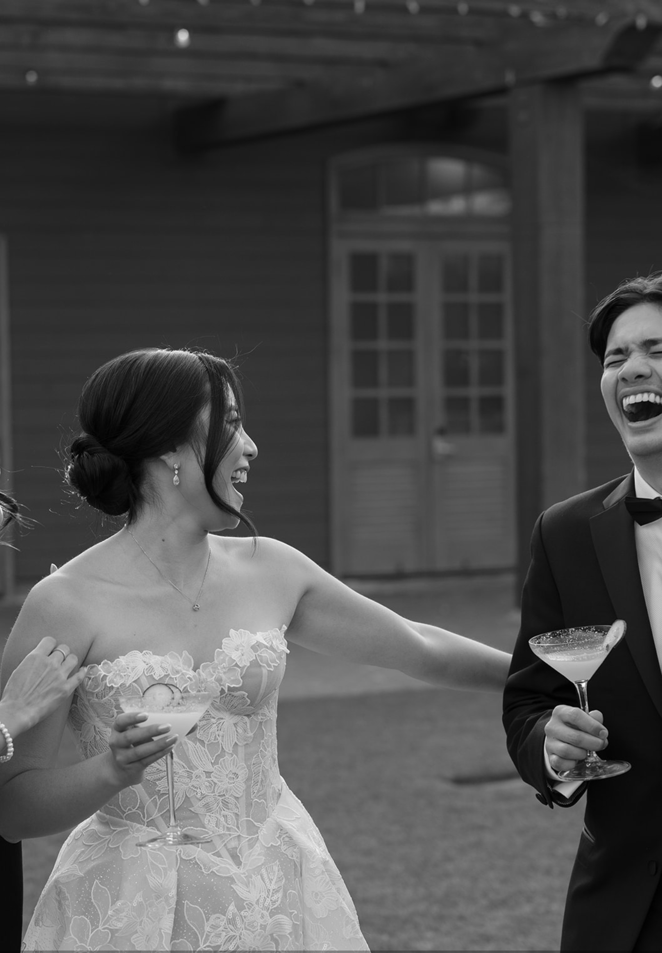 Joyful moments captured in black and white during outdoor wedding celebration.