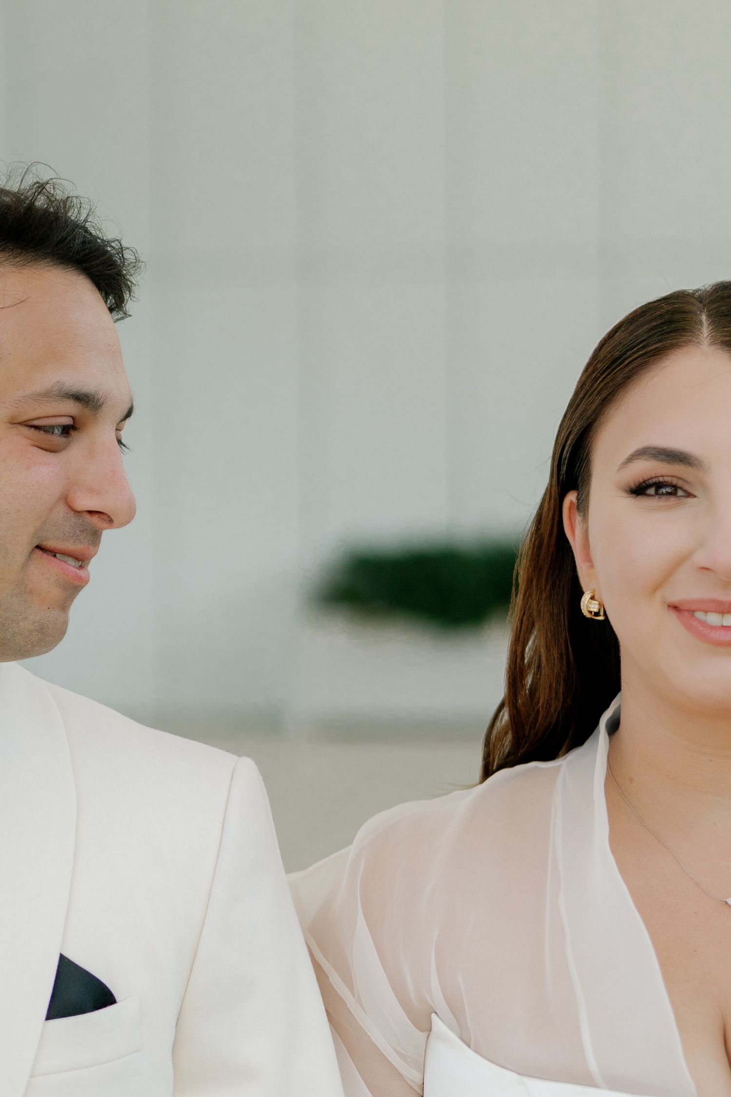 Close-up shot of a couple sharing an intimate moment in wedding attire.