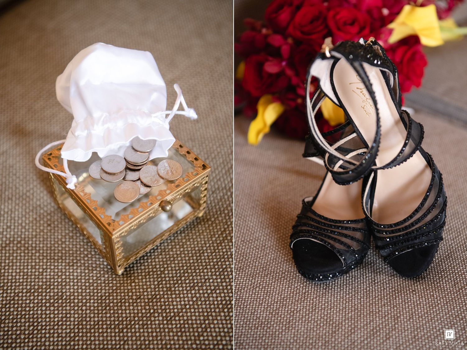 Gold chest with coins and white lace next to elegant black strappy heels on a textured surface with red flowers.