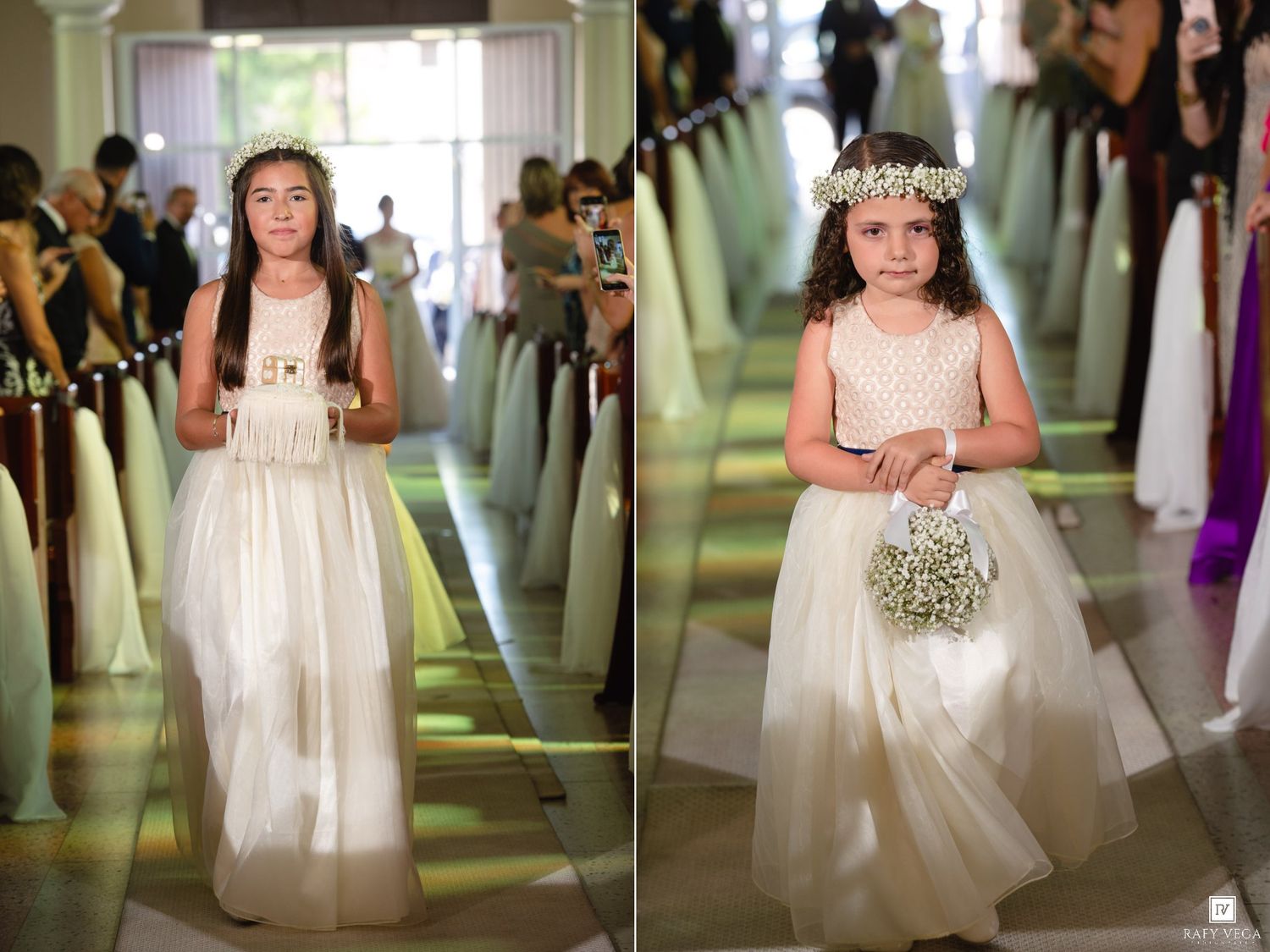 Two flower girls in white dresses with floral crowns walking down church aisle during wedding ceremony.