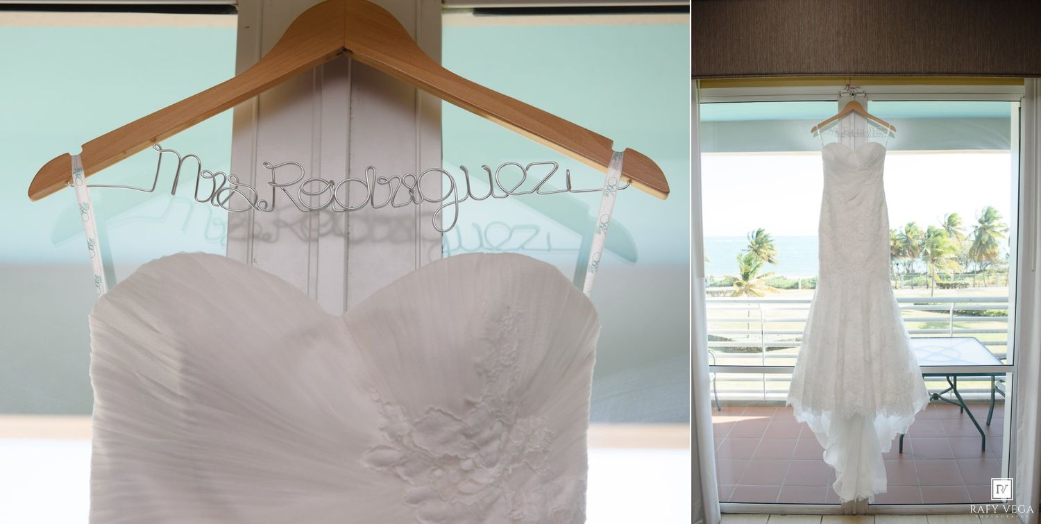 White strapless wedding dress on a custom Mrs. hanger displayed near a window with ocean views.