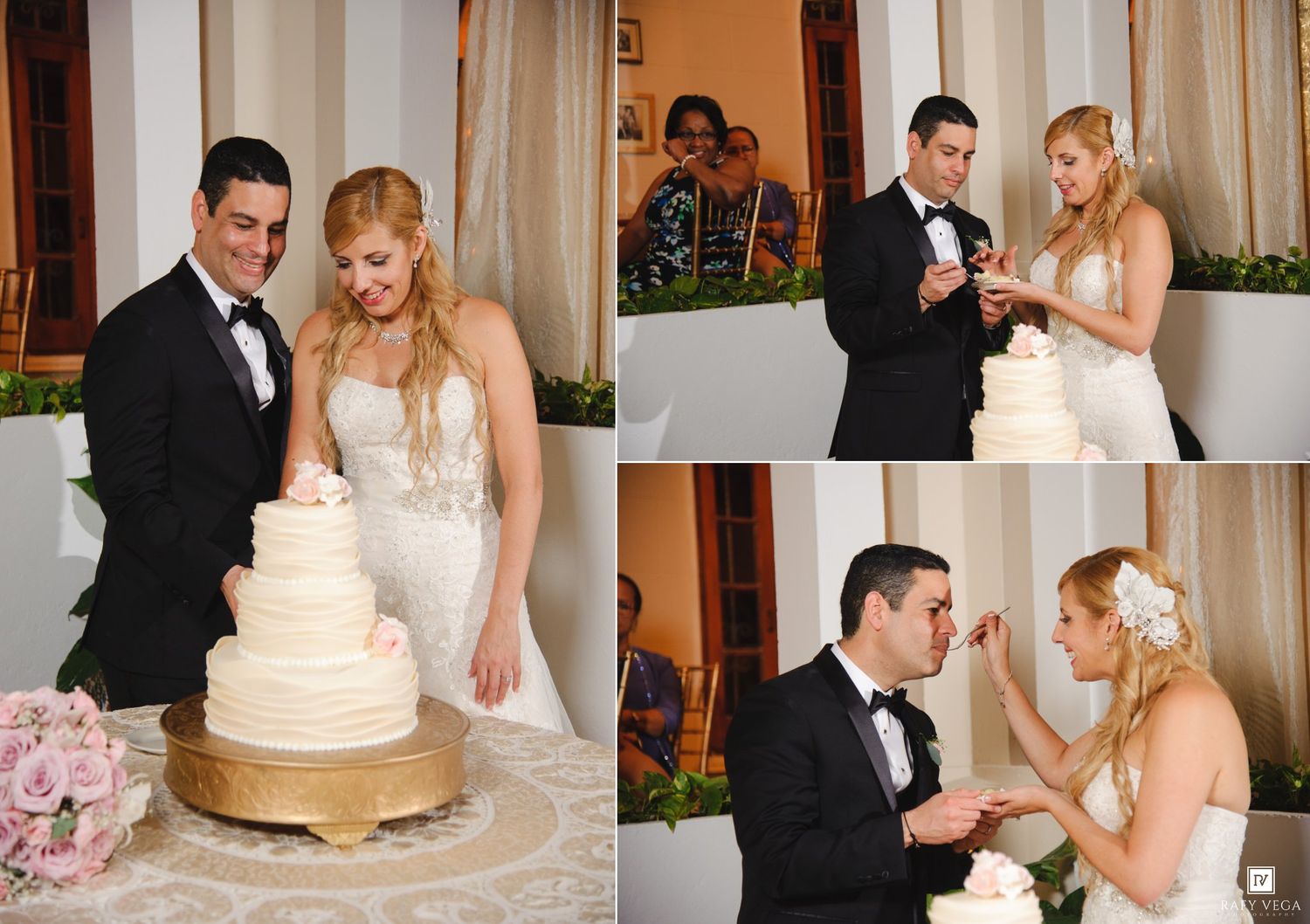 Bride and groom cutting and sharing wedding cake at elegant reception.