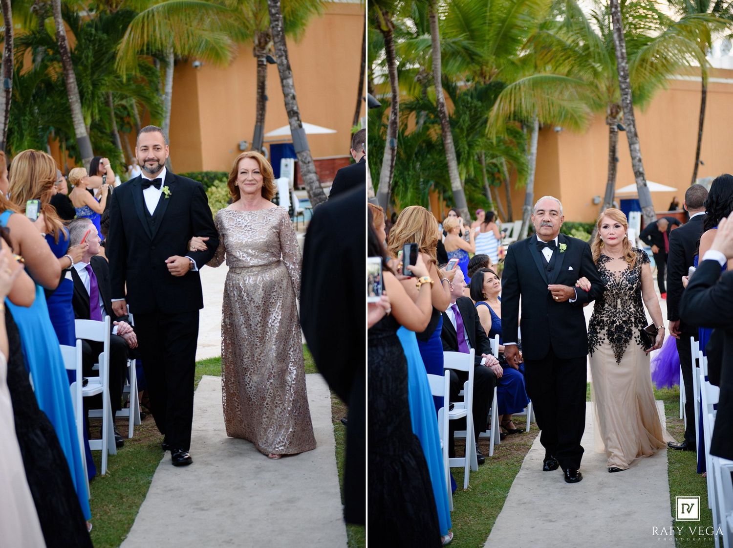 Elegantly dressed couples escort parents down outdoor wedding ceremony aisle flanked by seated guests and palm trees.