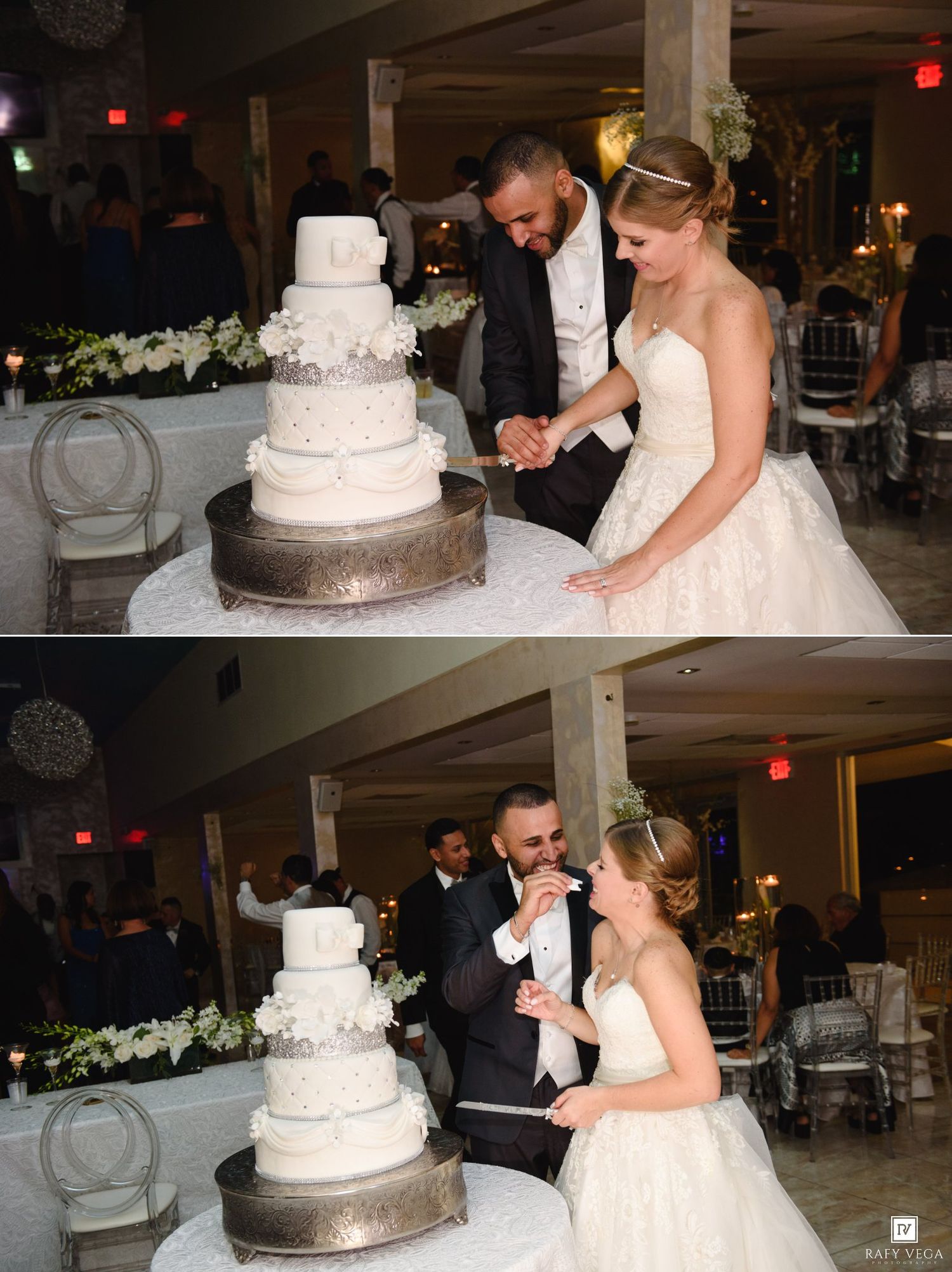 Bride and groom cut and share their elegant four-tier white wedding cake at their reception.