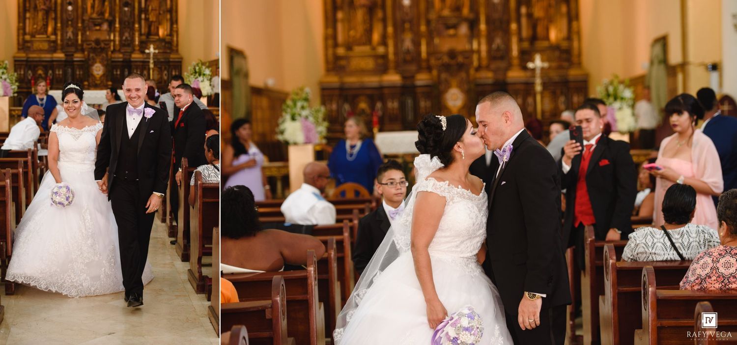 Bride and groom walking down church aisle after wedding ceremony, smiling joyfully among seated guests.