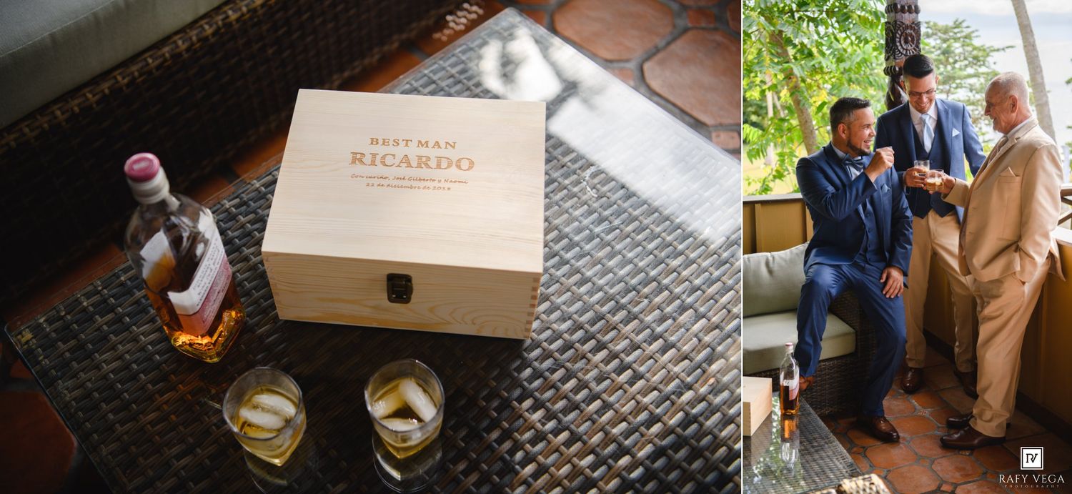 Personalized wooden best man gift box for Ricardo with whiskey glasses and bottle beside groomsmen in navy suits.
