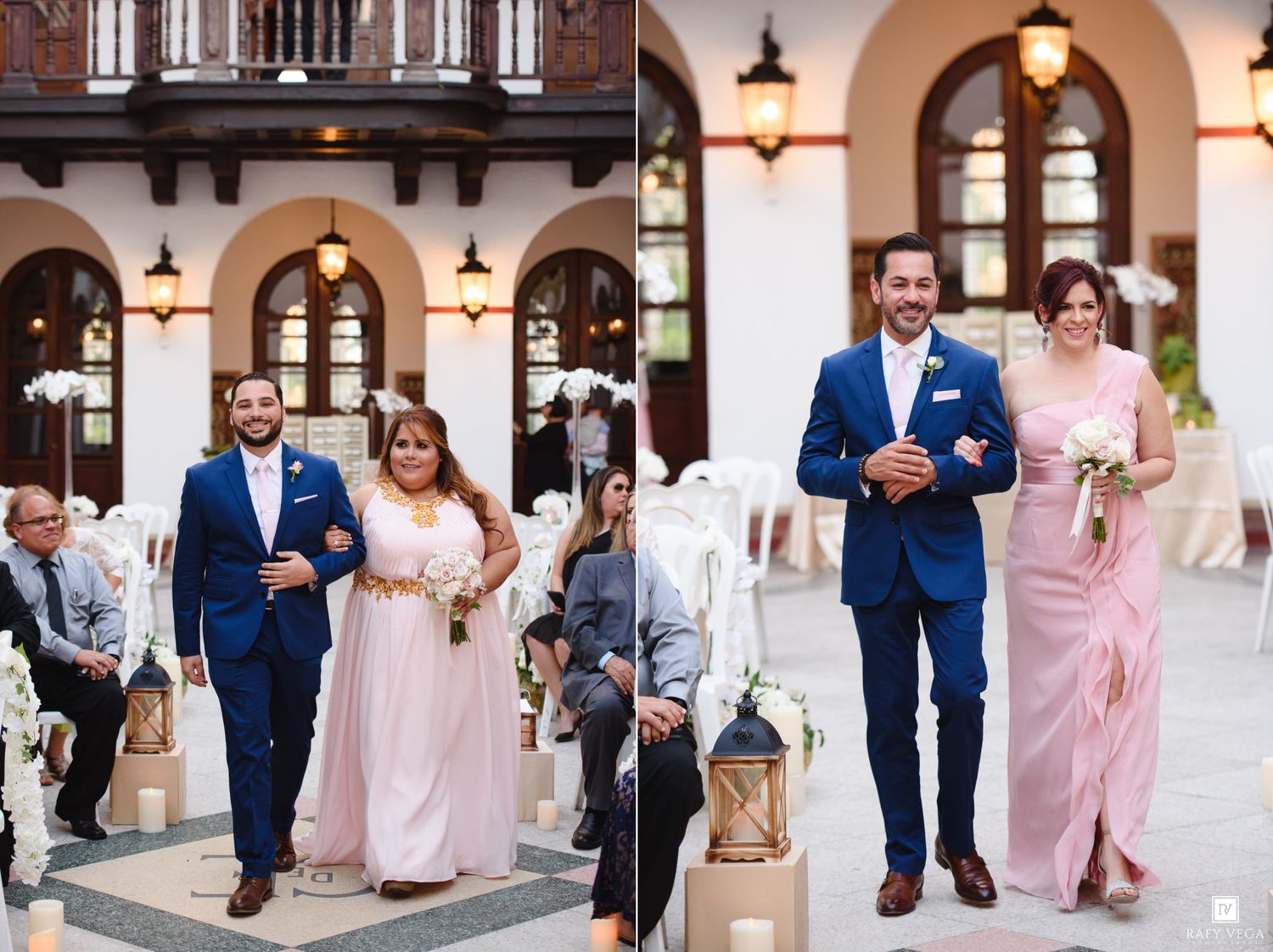 A groom in a navy suit escorts a bridesmaid in a pink gown down the aisle at an elegant outdoor wedding ceremony.
