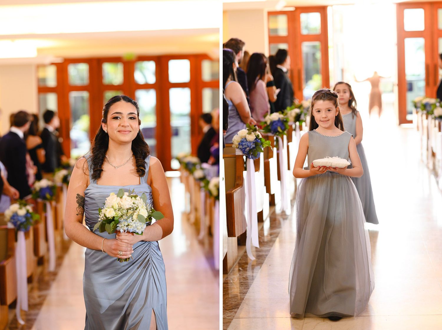 Bridesmaids in silver-blue gowns walk down a church aisle carrying white bouquets during an elegant wedding ceremony.