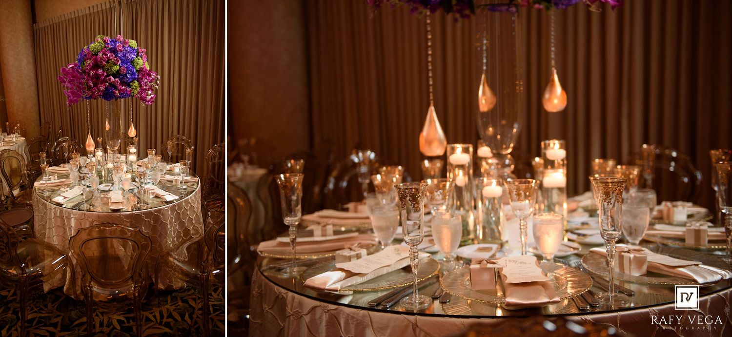 Luxurious wedding reception decor featuring mirrored tables, hanging candle pendants, and tall floral arrangements.