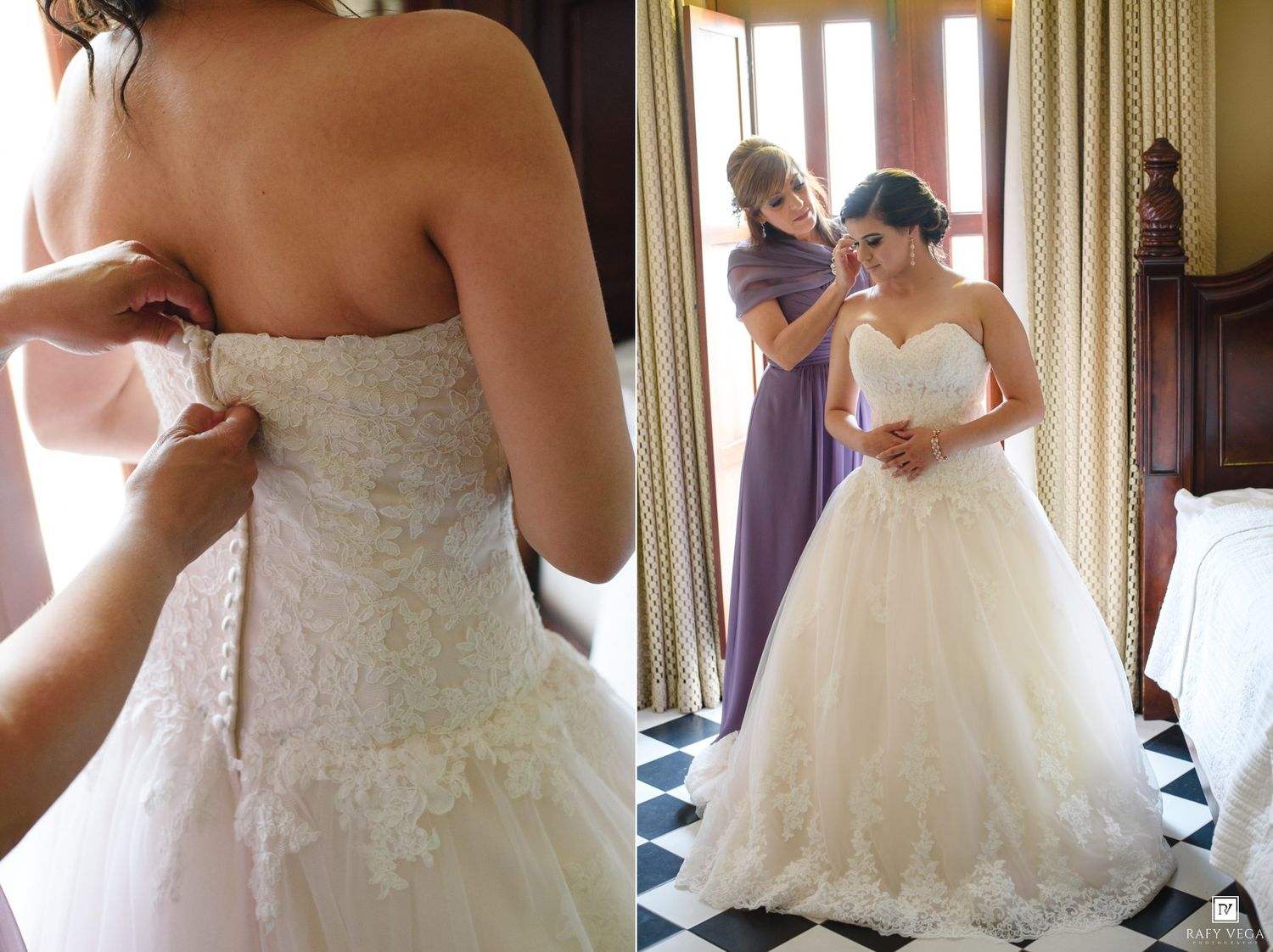 Bride in strapless lace ball gown wedding dress being helped by bridesmaid in purple dress in elegant bedroom.