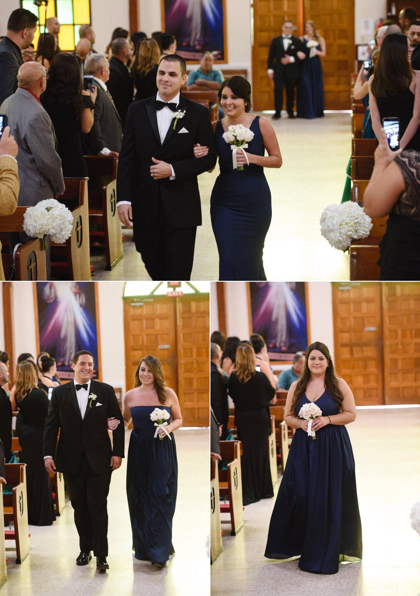 Bridesmaids in navy gowns walk down church aisle with groomsmen in tuxedos during elegant wedding ceremony processional.
