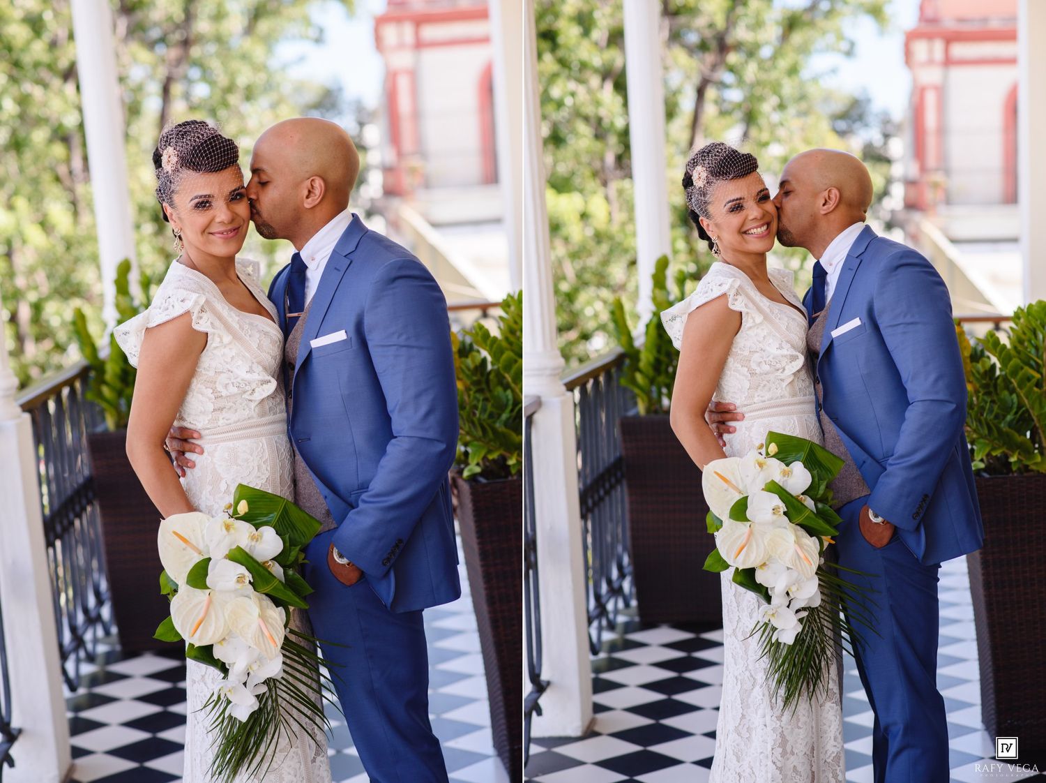 Bride and groom share a romantic kiss on a decorated porch, bride holding white bouquet in elegant wedding attire.