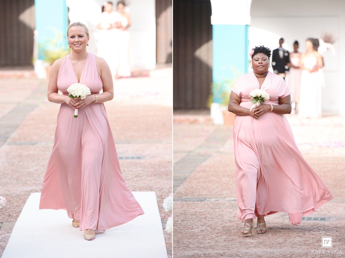 Two bridesmaids in elegant pink maxi dresses walking down the aisle at an outdoor wedding ceremony.