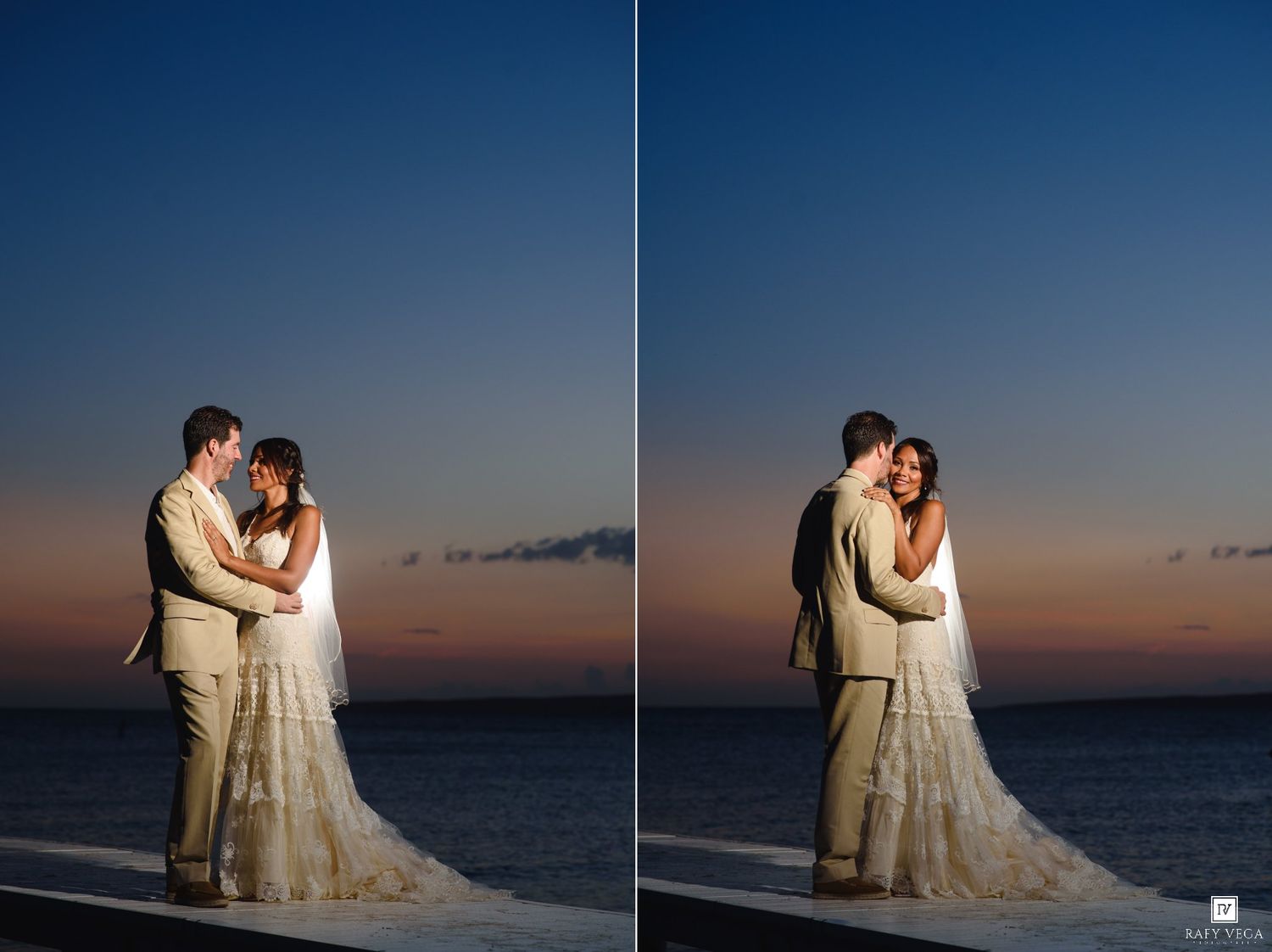 Bride and groom share a romantic embrace at sunset by the ocean in matching ivory wedding attire.