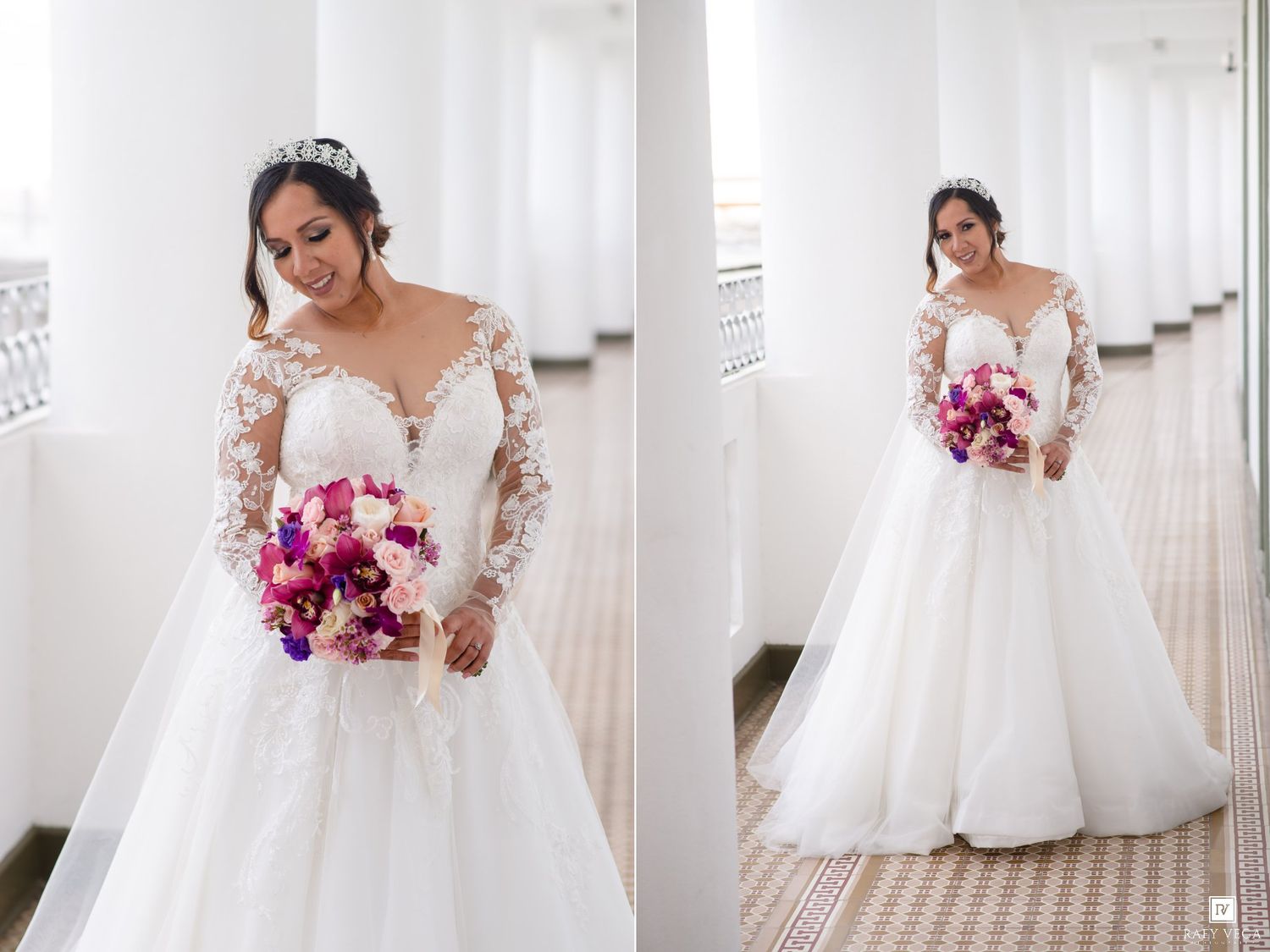 Bride in lace long-sleeve ball gown with tiara holding pink and purple bouquet, posing in elegant white colonnade.