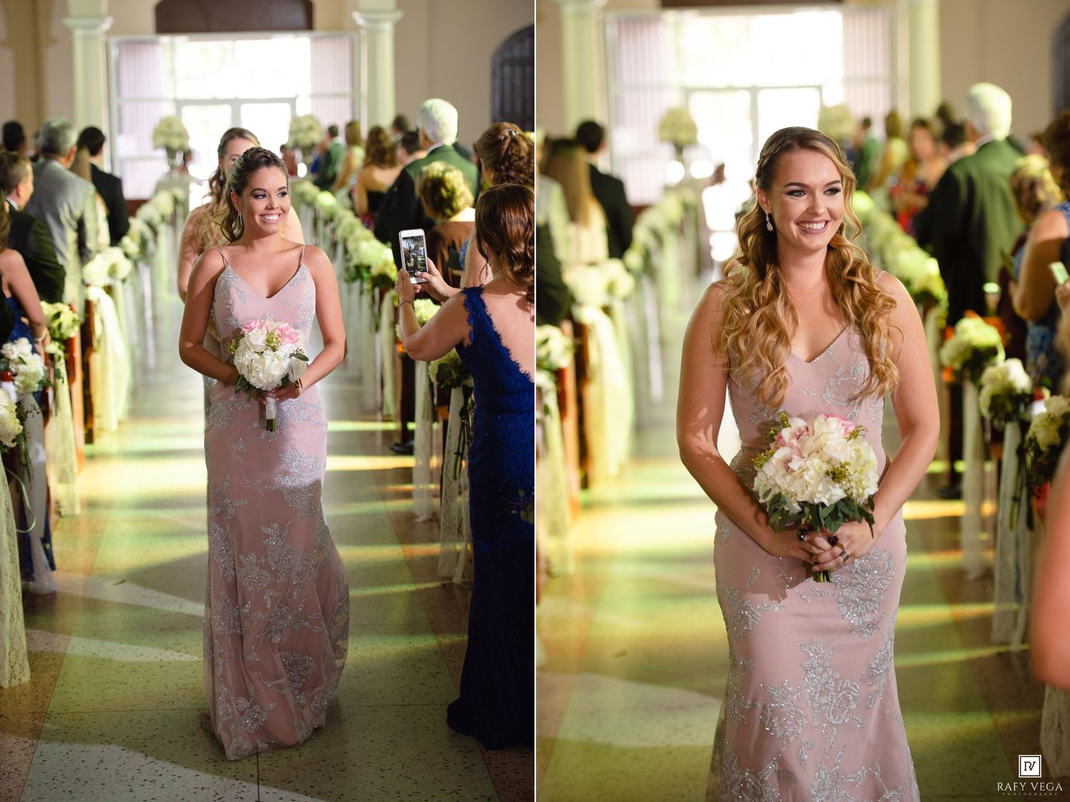 Bridesmaid in pink lace gown walks down church aisle holding white bouquet during elegant wedding ceremony.