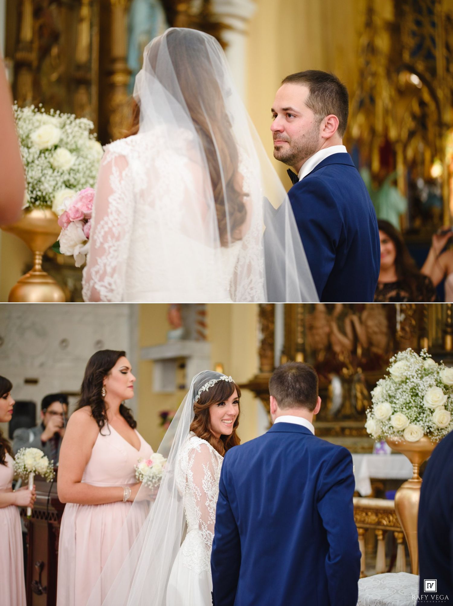 Bride and groom exchange vows at ornate church altar, groom in navy suit gazes at veiled bride in lace wedding gown.