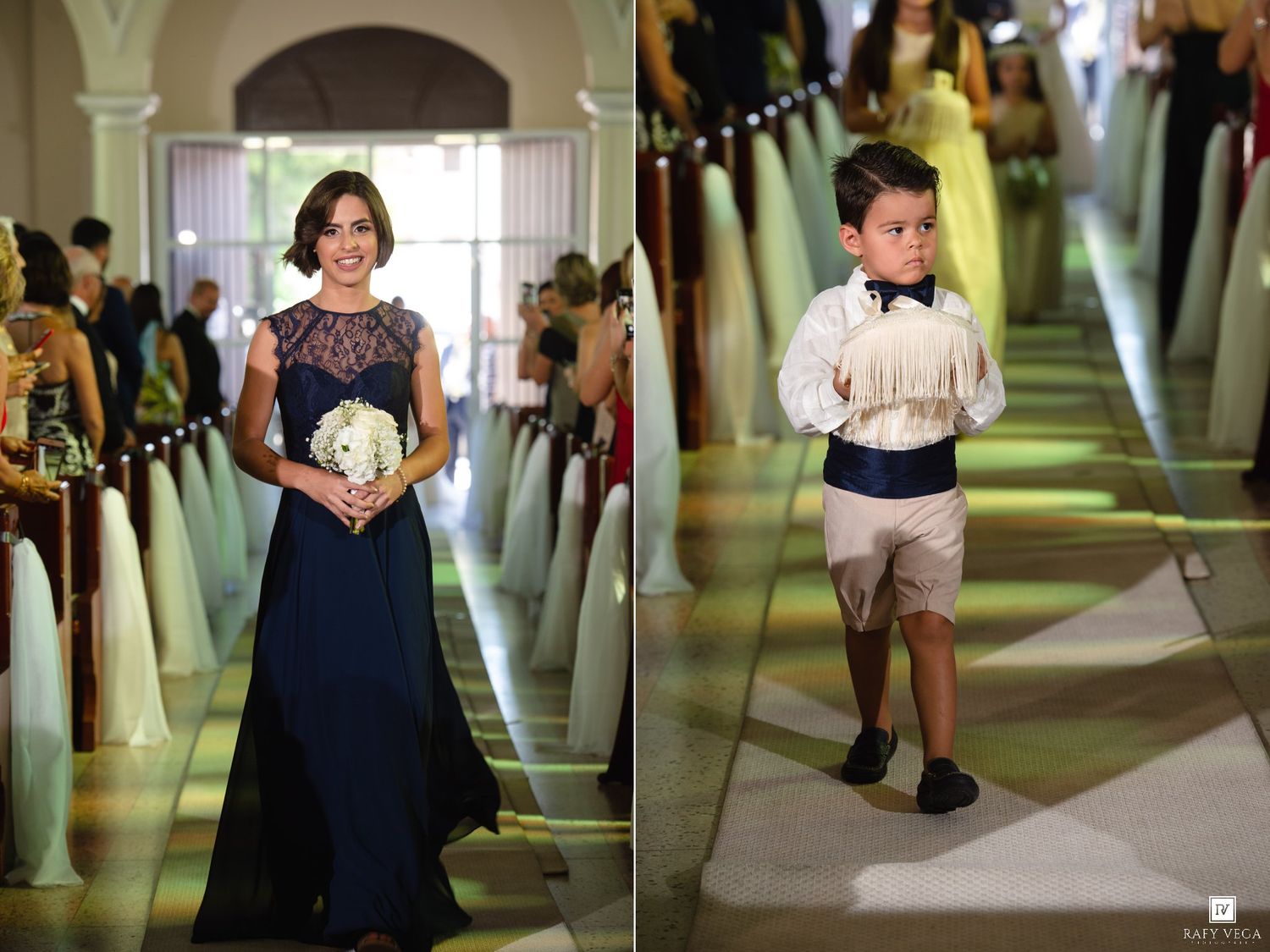A bridesmaid in navy blue gown holds white bouquet as a young ring bearer in suspenders walks down the aisle.