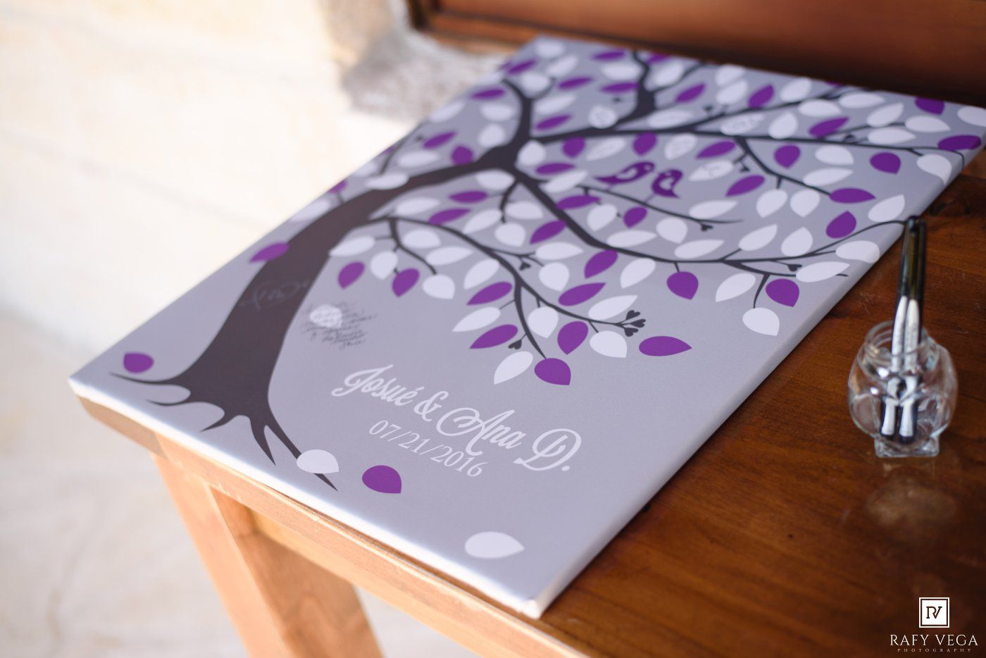 Purple and gray wedding guest book canvas with fingerprint tree design, personalized with couple names and wedding date.