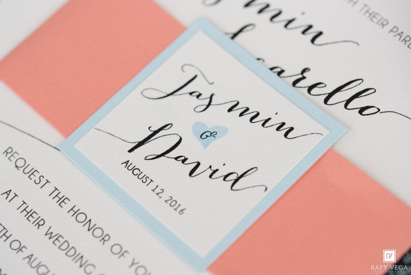 Elegant wedding invitation suite for Jasmin and David, August 12 2016, featuring coral and light blue accents with calligraphy script.