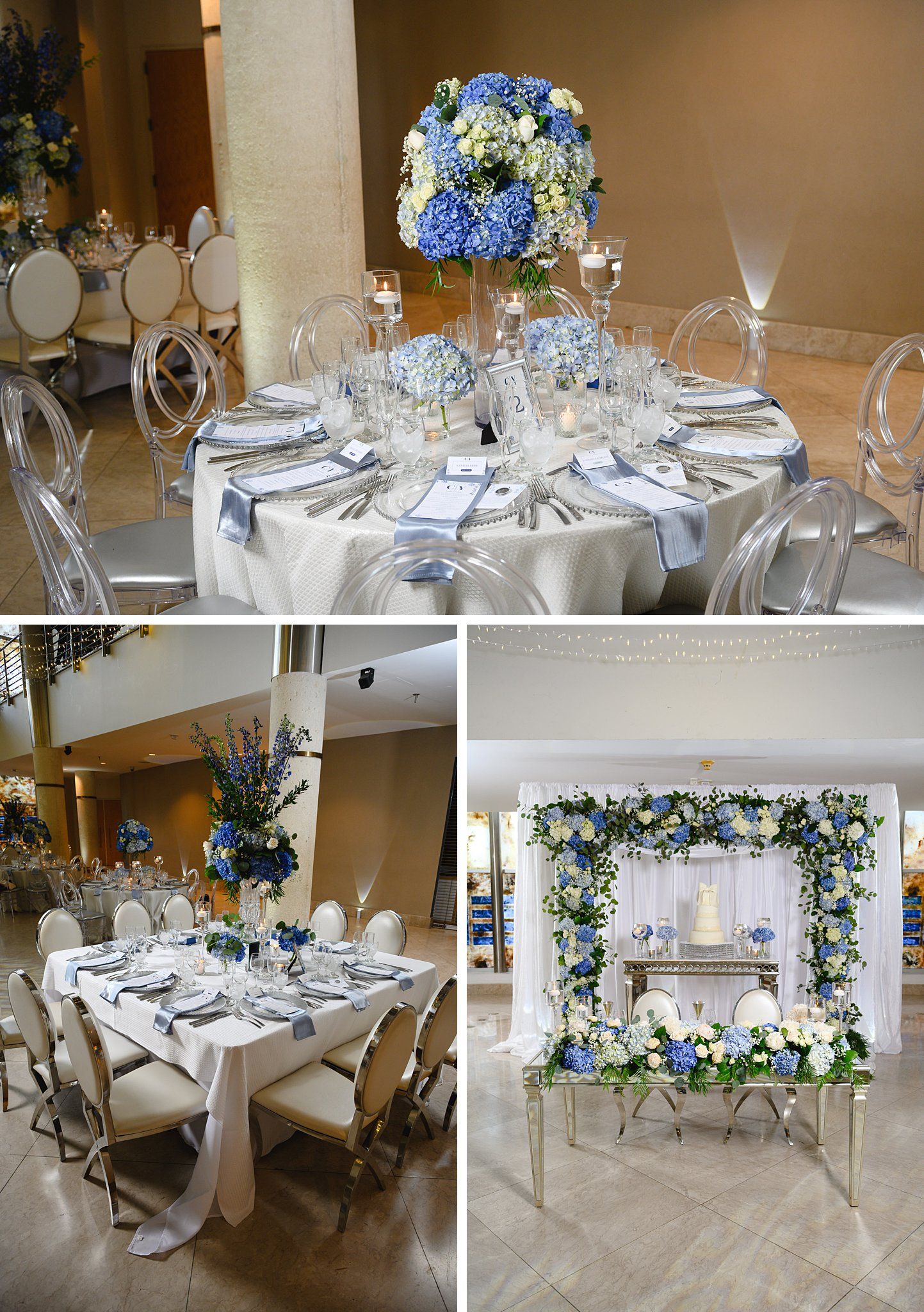 Elegant wedding reception tables adorned with blue hydrangea centerpieces, ghost chairs, and silver linens in a luxury ballroom.