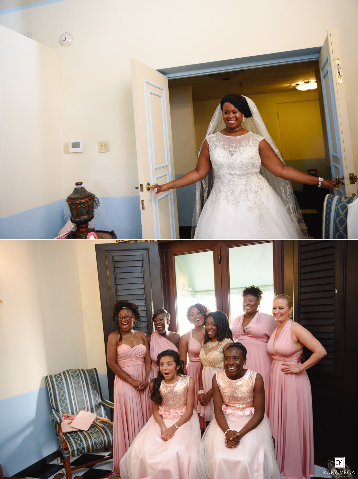 Bride in white lace gown entering room with bridesmaids in pink dresses smiling at wedding celebration.