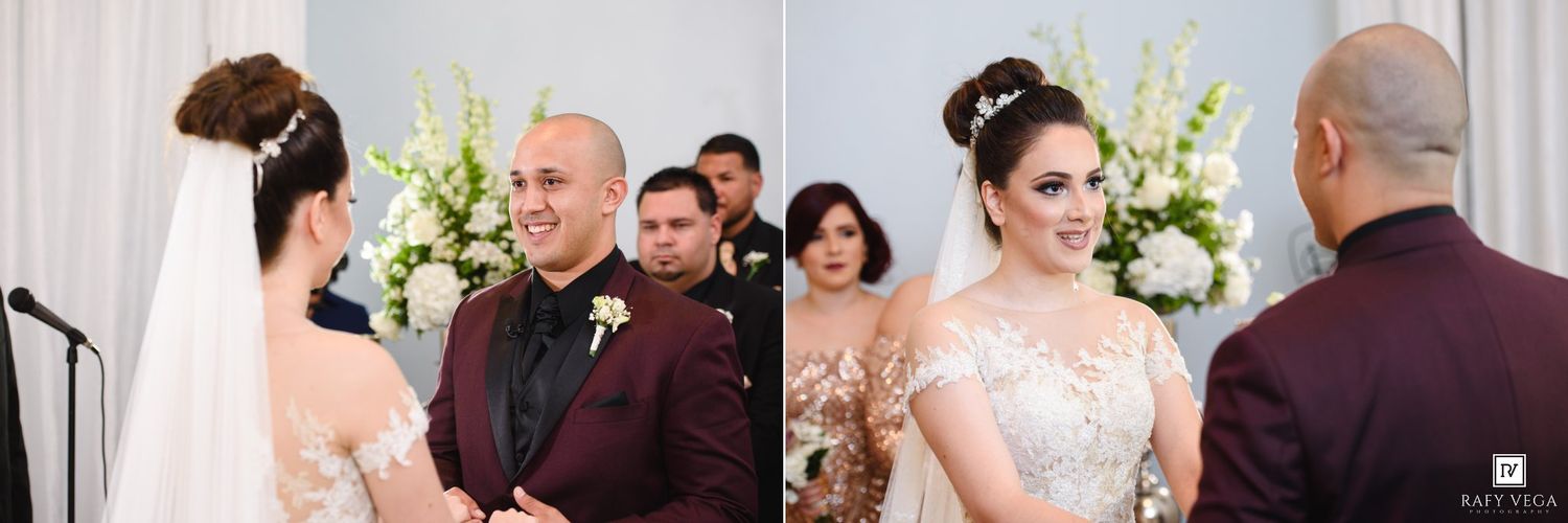 Bride and groom exchange vows at floral altar, smiling joyfully during elegant wedding ceremony.