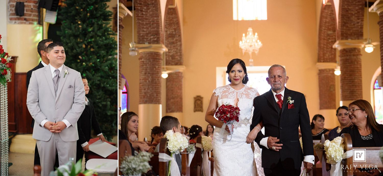 Bride walking down church aisle with escort toward waiting groom during wedding ceremony.