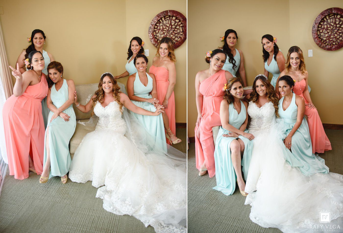 Bride in white gown poses with bridesmaids in coral and mint dresses for wedding party photos.