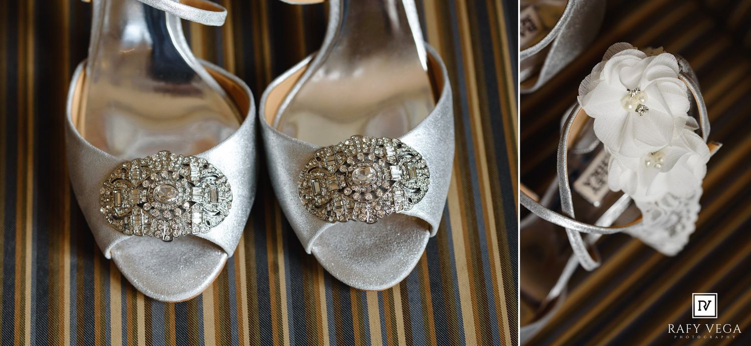 Elegant silver bridal heels adorned with crystal embellishments displayed alongside a delicate white floral garter.