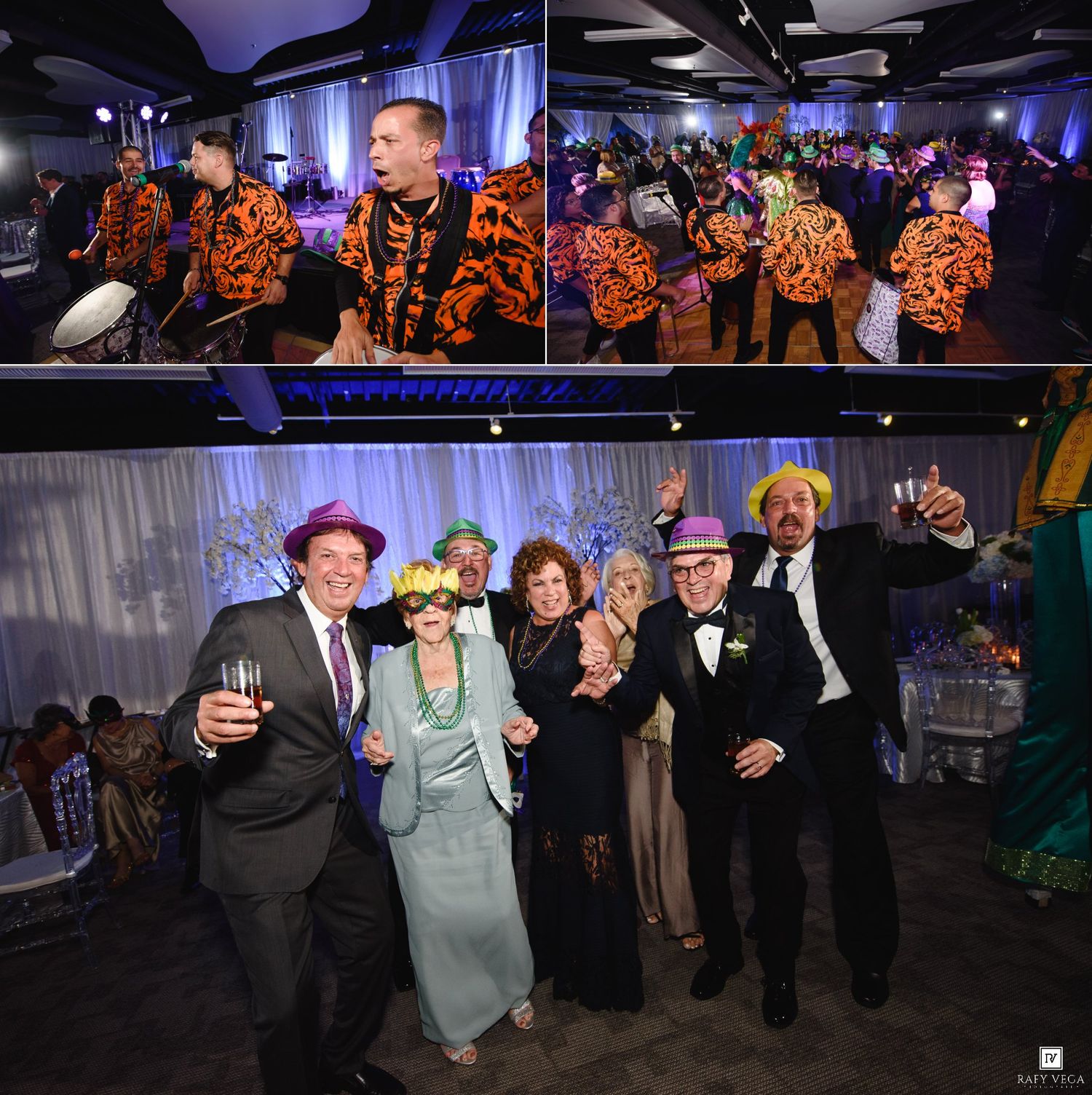 Guests in colorful costumes and fun hats celebrate at a festive gala event with a live band performing on stage.