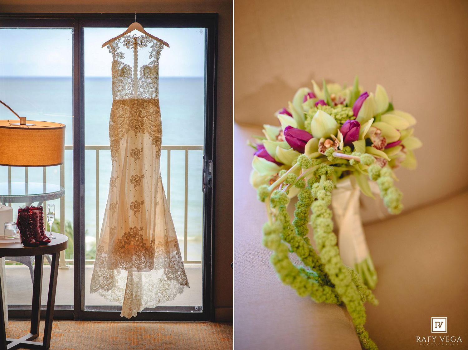 Elegant lace wedding dress hanging by ocean view window beside a vibrant green and purple bridal bouquet.