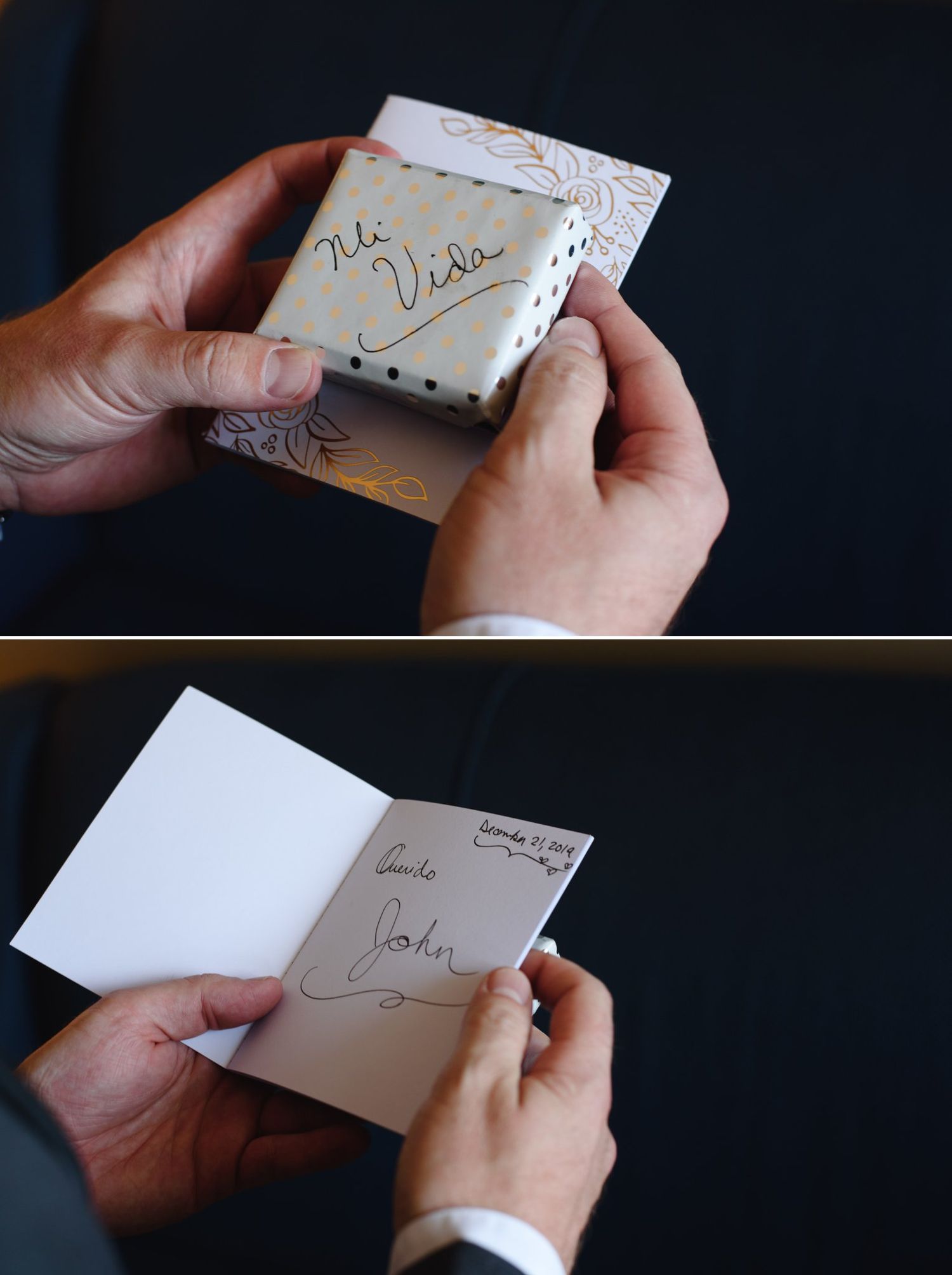 Man holding a decorative gift box labeled Mi Vida and opening a card signed by John at a wedding.