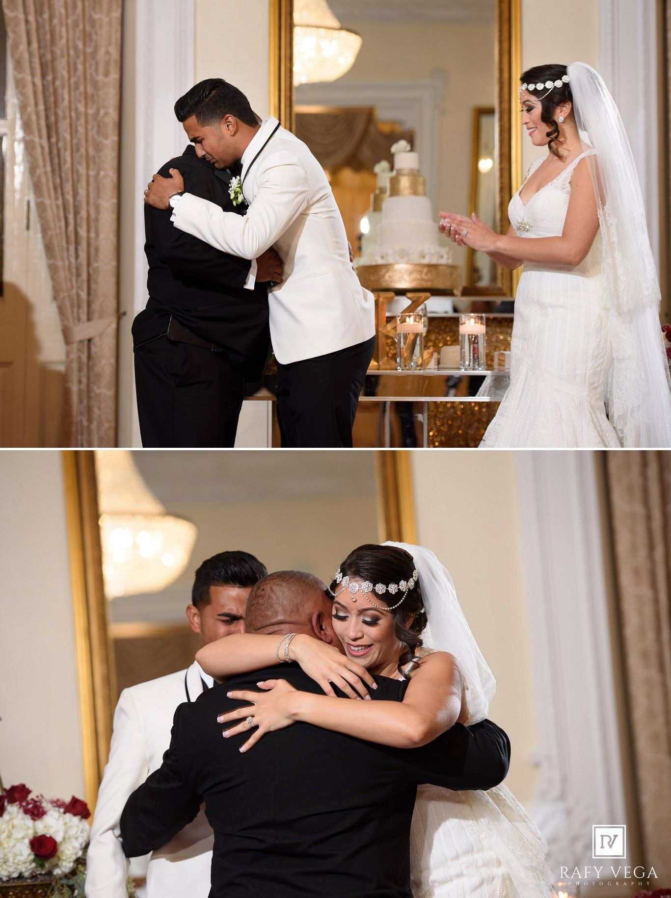Bride and groom share emotional hugs with a guest during their elegant wedding reception near a tiered cake.