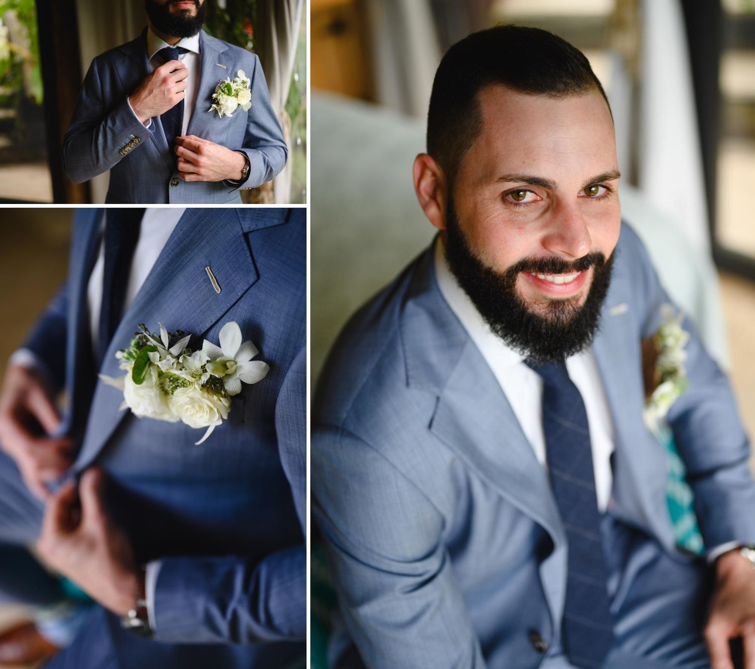 Handsome bearded groom in blue suit adjusting tie with white boutonniere, smiling confidently at wedding.